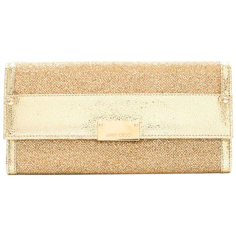 Jimmy Choo gold glitter clutch