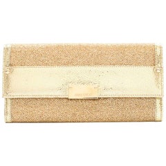 Jimmy Choo gold glitter clutch