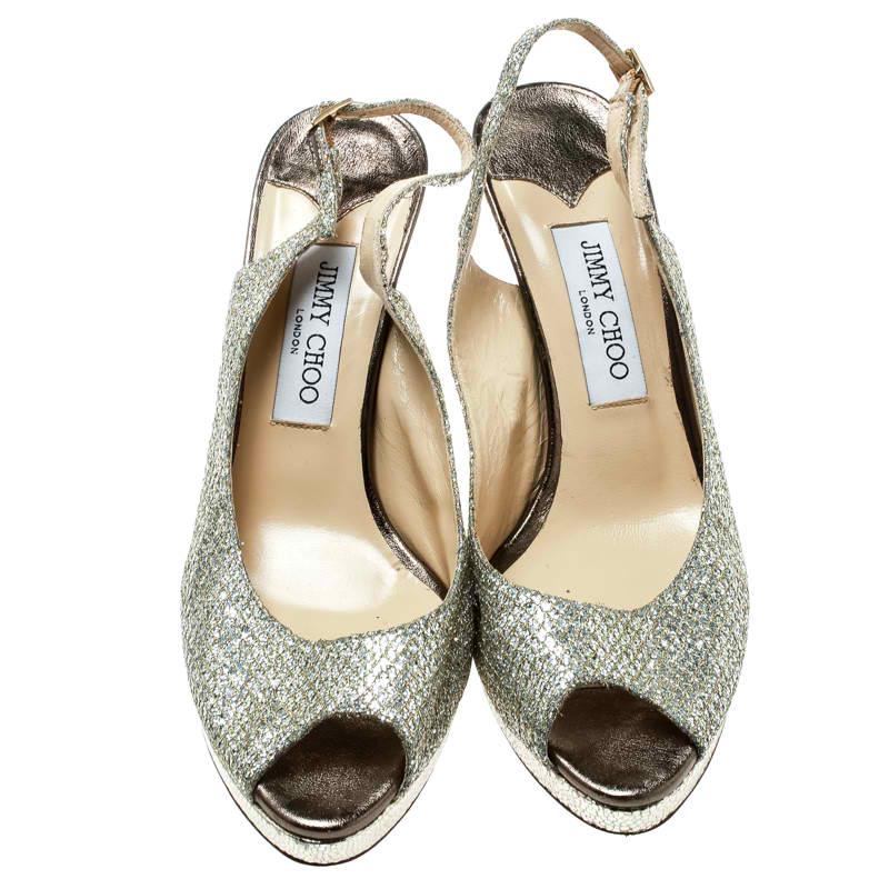 We all need a pair of shoes as lovely as these slingback sandals from Jimmy Choo. They've been covered in metallic gold glitter and designed with peep toes, buckle-held slingbacks, and 10.5 cm heels supported by platforms.

Includes: The Luxury