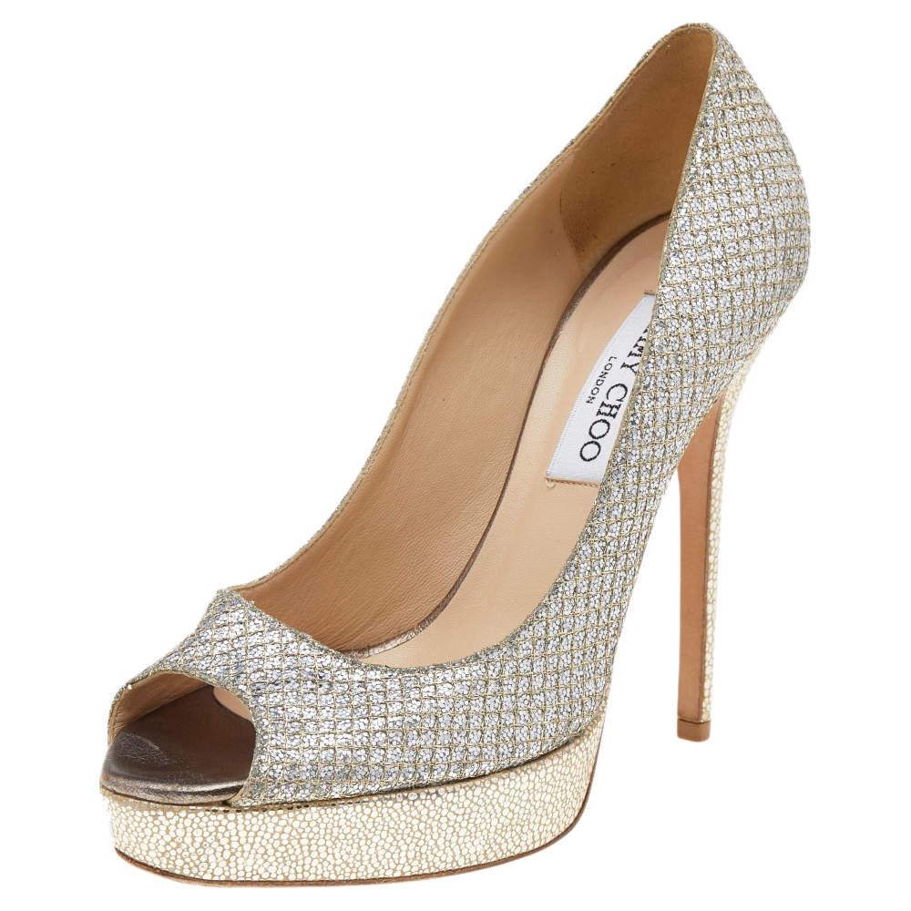 Wear these Luna pumps from the house of Jimmy Choo and channel your inner fashionista. This pair of pumps are glamorous and crafted from gold-hued glitter. They have peep toes, platforms, and 12.5 cm heels. They are finished with leather soles.