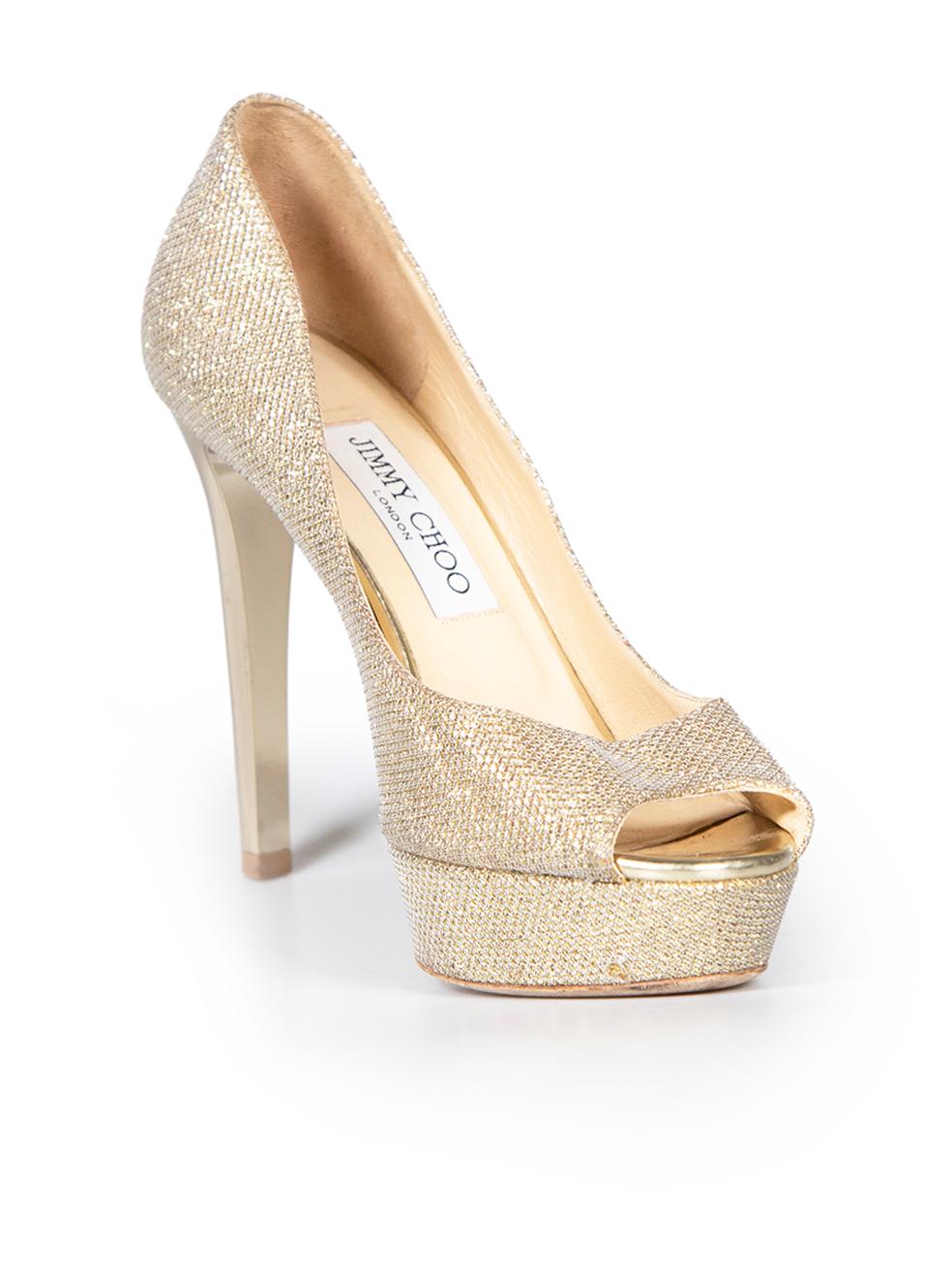 CONDITION is Very good. Minimal wear to shoes is evident. Minimal wear to both shoe toes and heels with abrasions on this used Jimmy Choo designer resale item.
 
 
 
 Details
 
 
 Gold
 
 Glitter
 
 Heels
 
 Peep toe
 
 Slip on
 
 Platform
 
 High