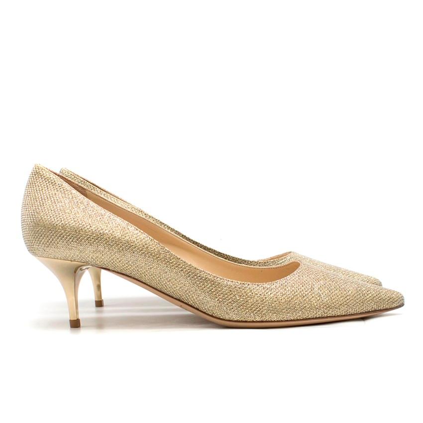 Jimmy Choo Sparkle Gold Pumps
 
 - Sparkle Gold Pumps
 - Woven upper fabric
 - Pointed toe, slip ons
 - Nude leather sole
 - 55 mm stiletto heel
 - Metallic mirrored heel
 
 Please note, these items are pre-owned and may show some signs of storage,