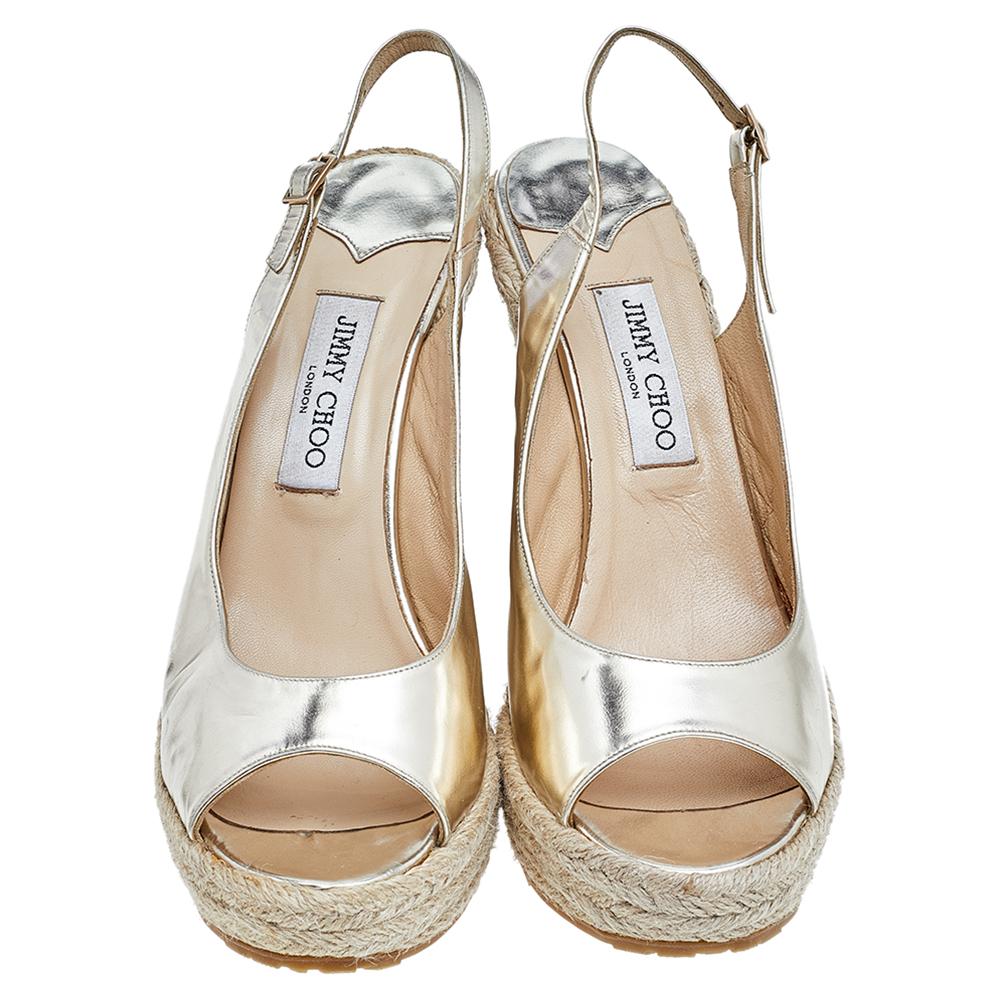 Featuring a simplistic shape, these sandals from Jimmy Choo showcase style and elegance. They are made using gold leather on the upper and come with espadrille wedges, a slingback, and open toes. These sandals bring effortless style without
