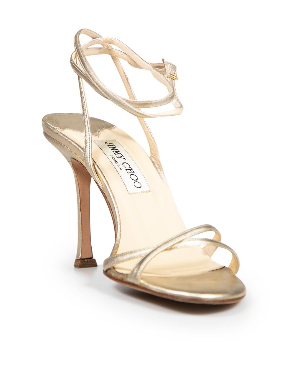 CONDITION is Good. Minor wear to sandals is evident. Light wear to both heels with marks and abrasions to the leather. The right shoe ankle strap has split slightly on this used Jimmy Choo designer resale item. These shoes come with original box.
 
