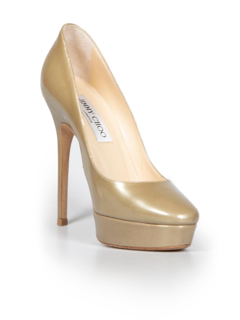 CONDITION is Very good. Minimal wear to heels is evident. Minimal wear to soles with some abrasions to the right side and left side of the right shoe on this used Jimmy Choo designer resale item.
 
 
 
 Details
 
 
 Gold
 
 Patent leather
 
 Slip on