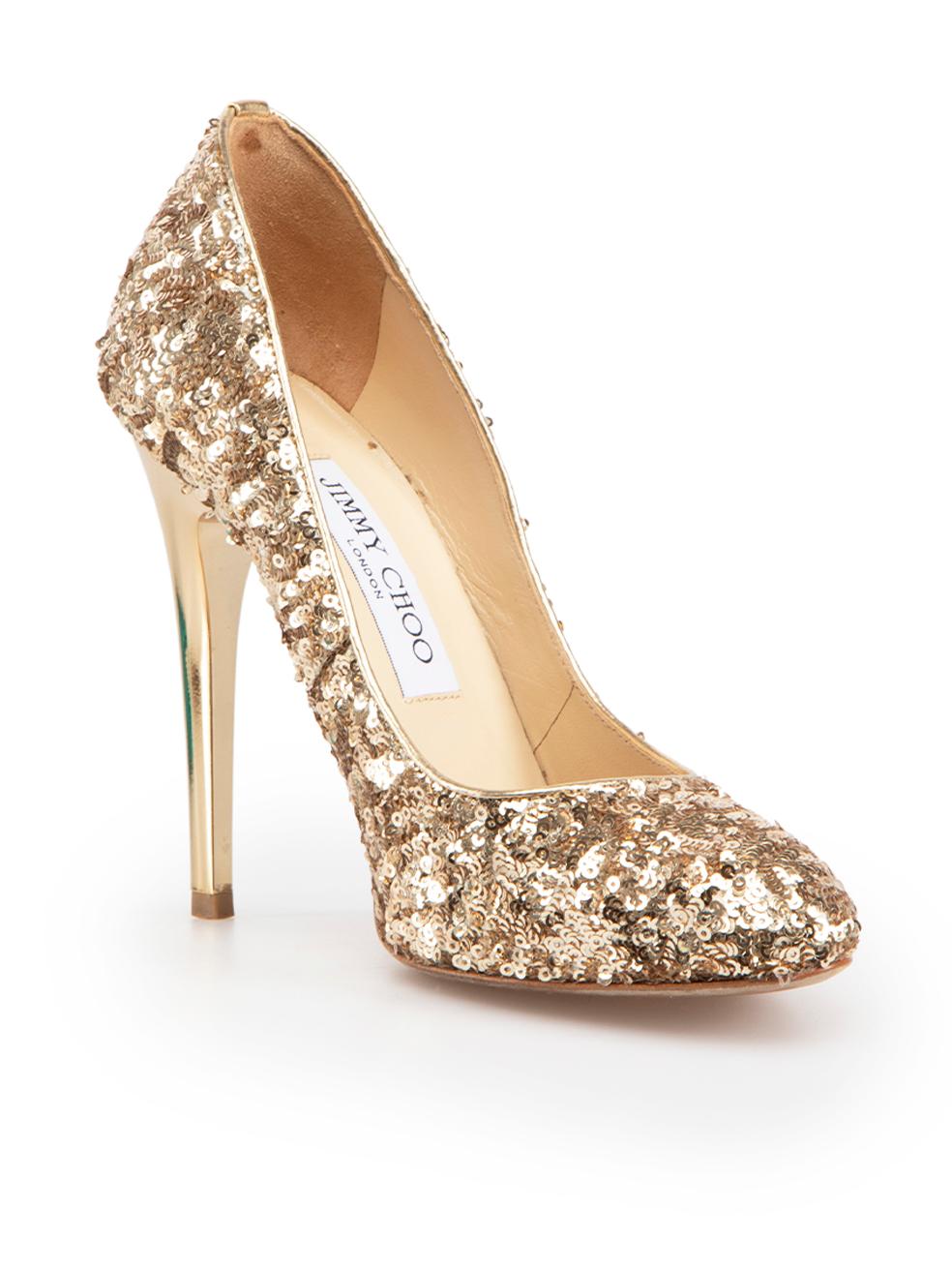 CONDITION is Very good. Minimal wear to shoes is evident. Minimal wear to both shoe heels with very light scratching on this used Jimmy Choo designer resale item. These shoes come with original box and dust bag.
 
 Details
 Victoria
 Gold
 Sequin
