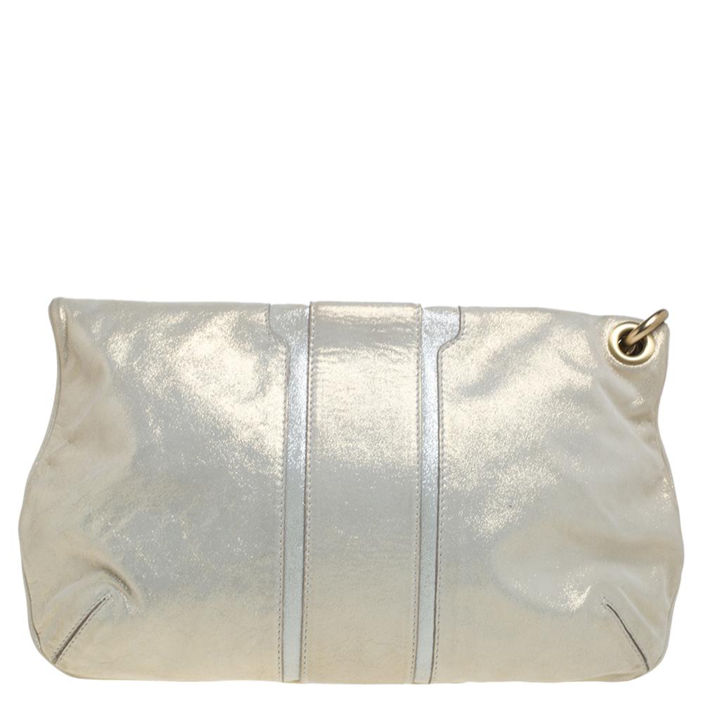 This Mave clutch from Jimmy Choo has a lovely shimmery sheen that will be sure to give shine to any outfit. With a flat leather wrist strap fastened to the bag, this creation has a zip fastening fold-down top and a zip pocket. The soft leather body