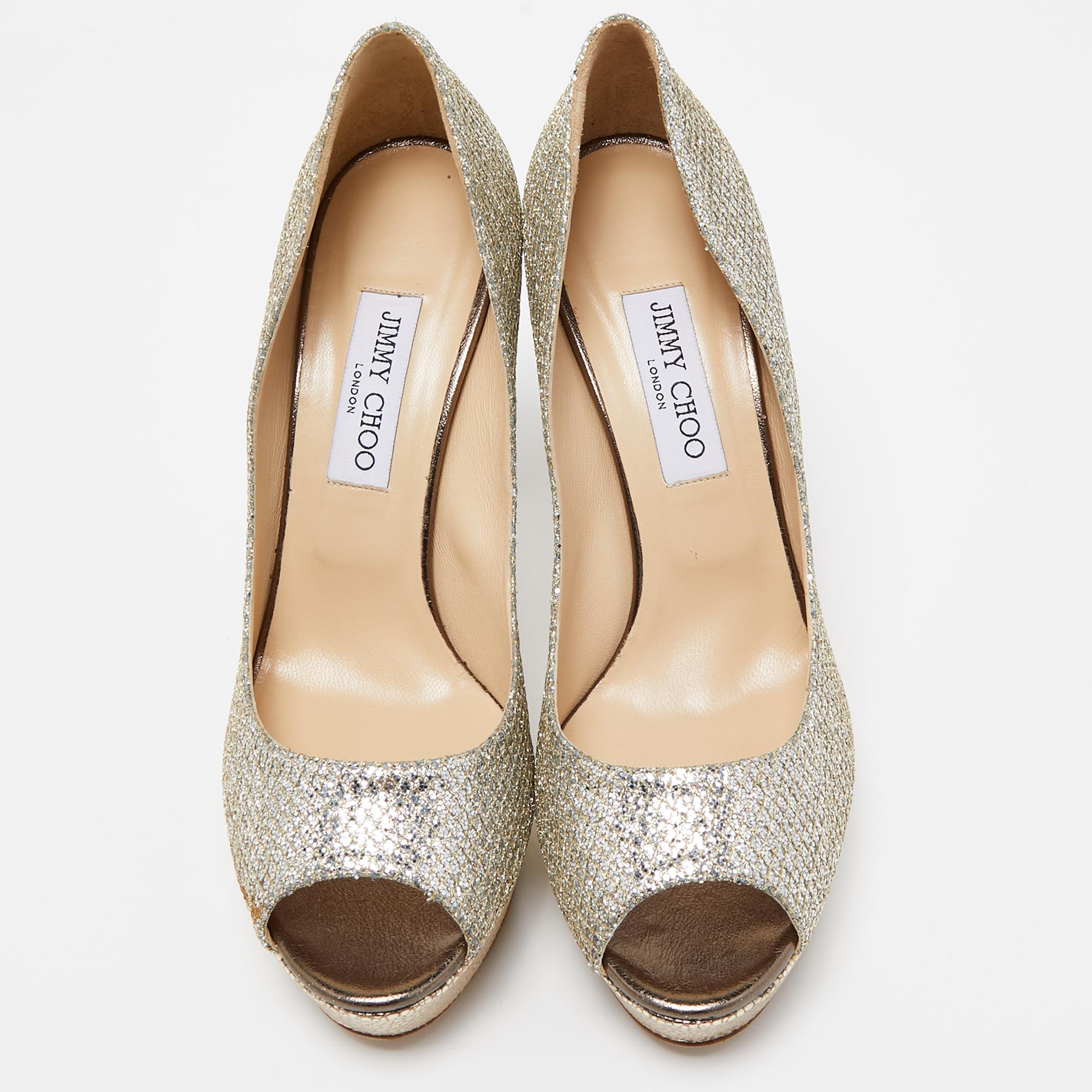Crafted in a classy hue, we love these Jimmy Choo pumps. Designed to make a statement, they have a sleek silhouette and a nice fit. Wear yours under maxi skirts for a peek of glamour, or let them shine with cropped hemlines.

Includes: Original Box

