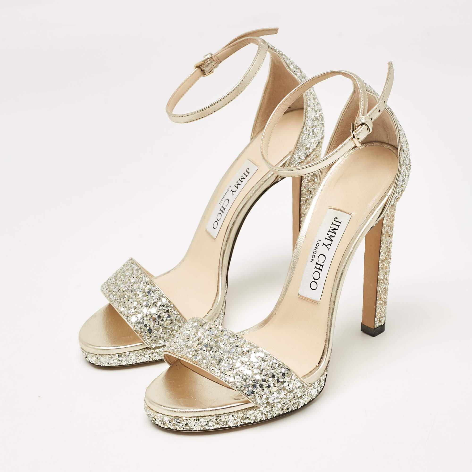 Covered in glitter  we love these Jimmy Choo heels. Designed to make a statement  they have a sleek silhouette and a nice fit. Wear yours under maxi skirts for a peek of glamour  or let them shine with cropped hemlines.