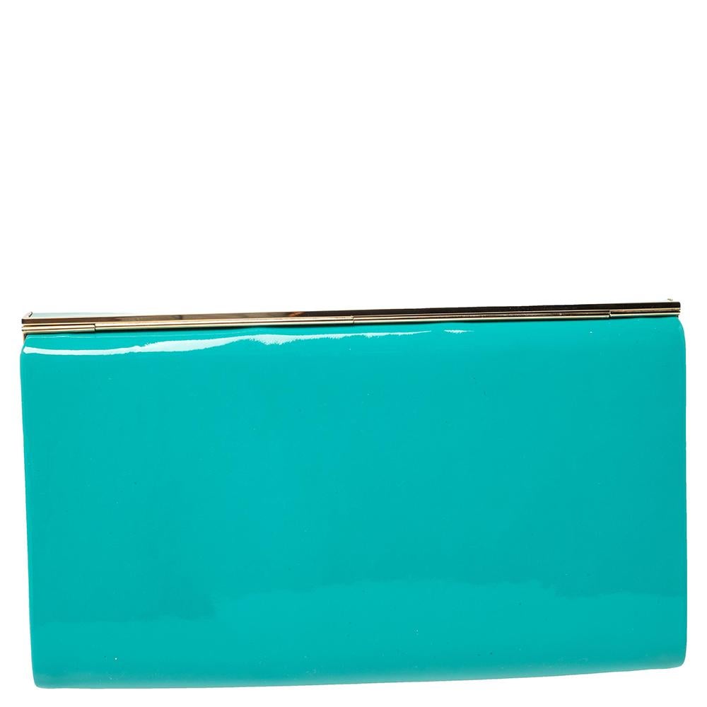 This gorgeous Cayla clutch by Jimmy Choo is a perfect example of the label's commitment to being chic, contemporary, and elegant at the same time. Designed to dazzle, this patent leather clutch has a magnetic snap-flap closure that opens to a