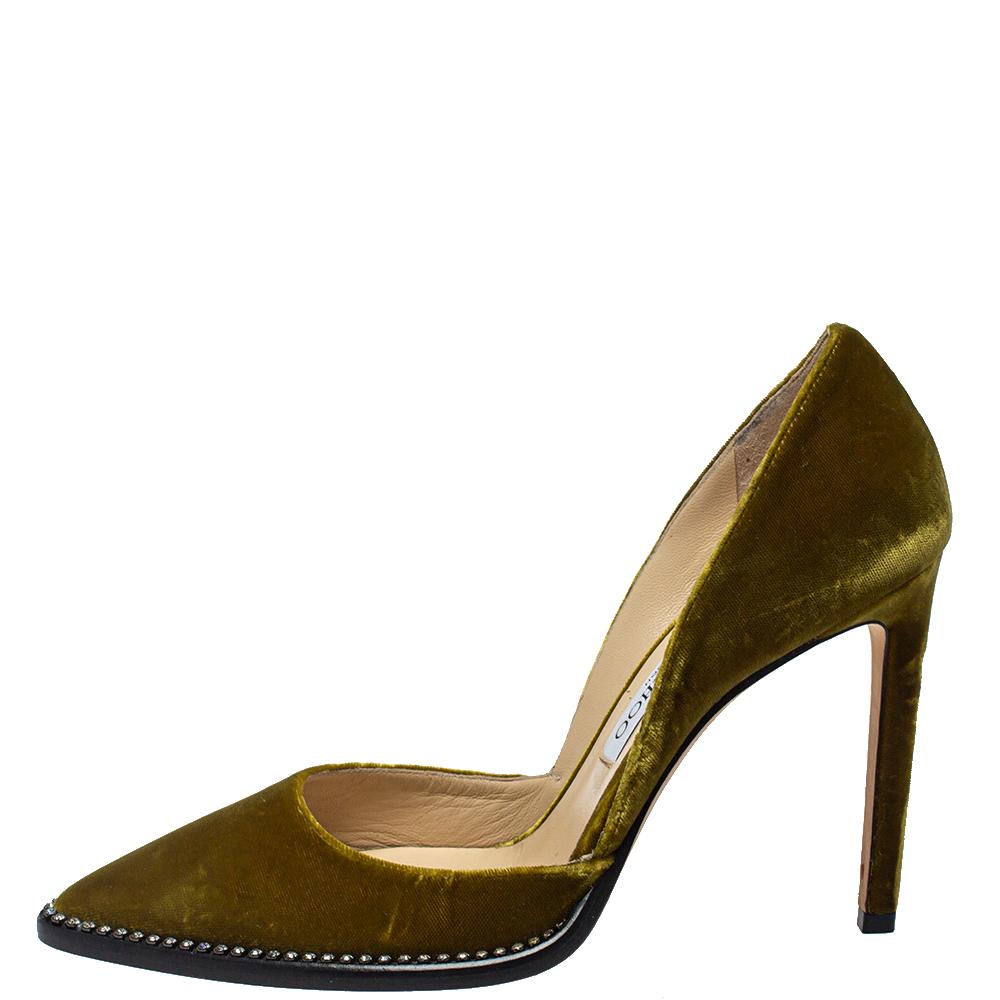 To perfectly complement your attires, Jimmy Choo brings you this pair of pumps that speak nothing but high style. They've been crafted from olive green velvet and decorated with embellishments on the front base. Elevated on 11 cm heels, these