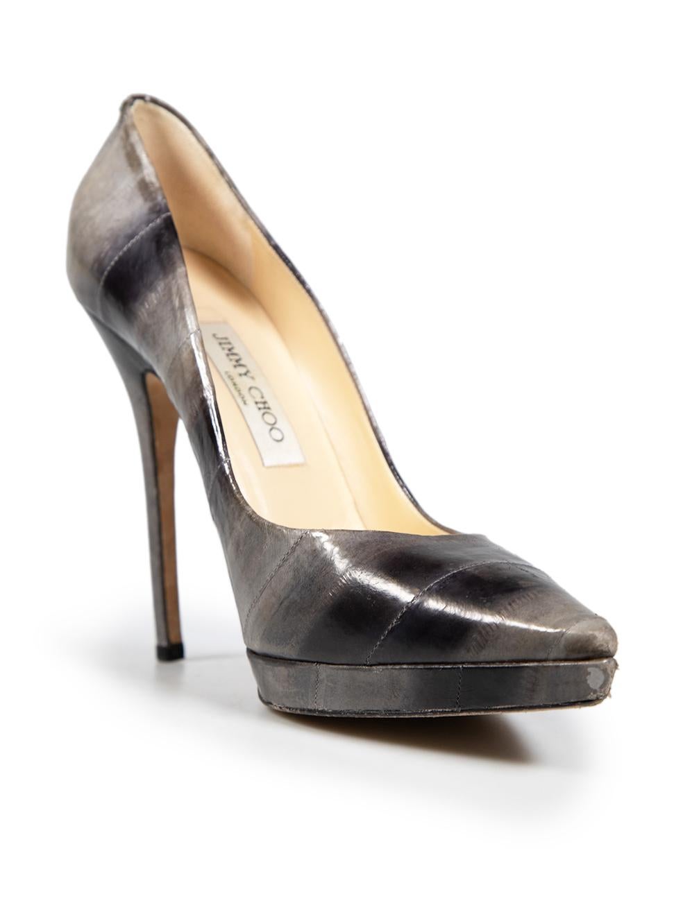 CONDITION is Good. Minor wear to heels is evident. The toe ends have substantial abrasions, with lifting of leather. The insoles have some small dried glue markings. There are small abrasions along the heels and side panels on this used Jimmy Choo