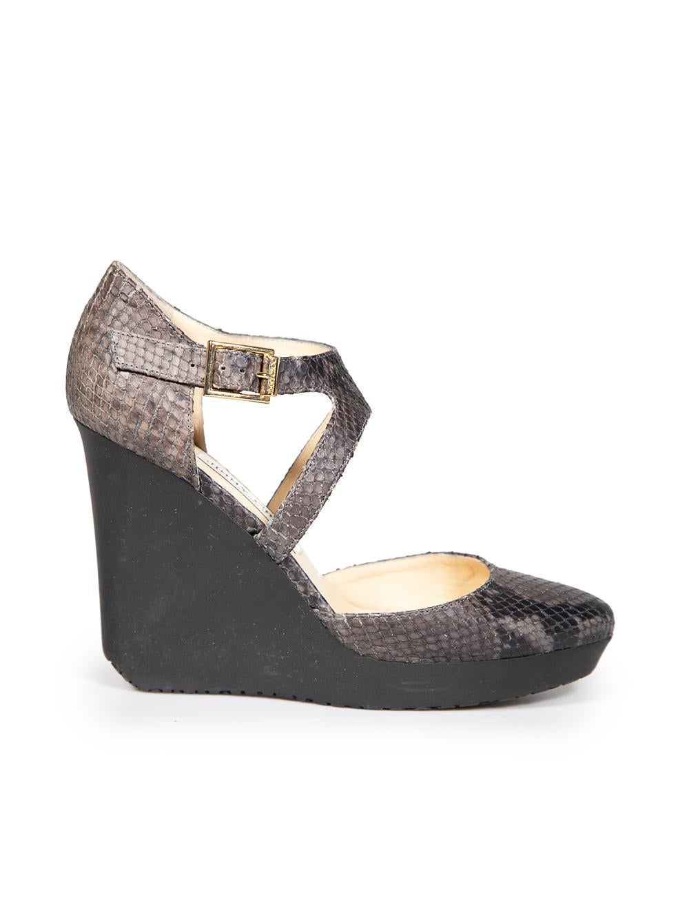 CONDITION is Very good. Minimal wear to the shoes is evident, there are small scratches on the heel of this used Jimmy Choo designer resale item. This item comes with the original box.
 

 

 

 Details
 

 

 Grey
 

 Leather
 

 Wedge sandals
 

