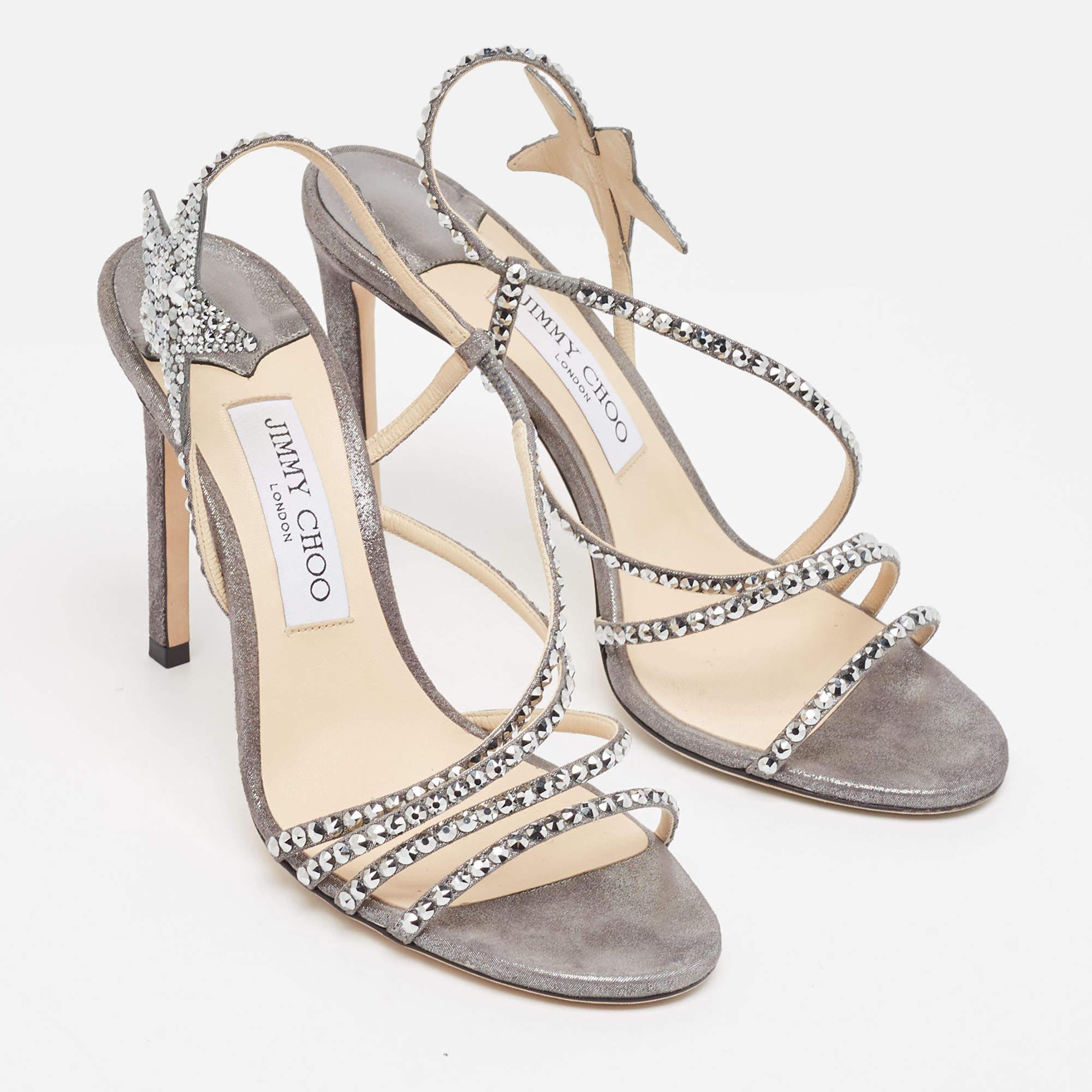 Lend an elegant finish to your look of the day with these Jimmy Choo shimmer sandals. They feature open toes, star details, and 10.5 cm heels.

Includes: Original Box

