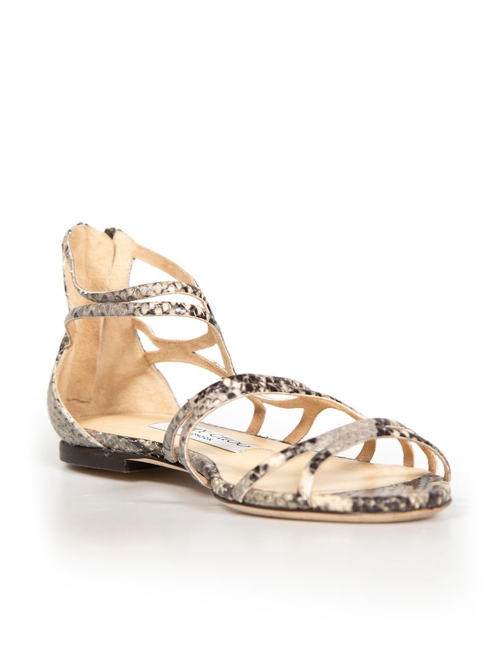 CONDITION is Very good. Minimal wear to sandals is evident. Minimal wear to soles on this used Jimmy Choo designer resale item.
 
 
 
 Details
 
 
 Sutri model
 
 Grey
 
 Snakeskin leather
 
 Strappy sandals
 
 Open toe
 
 Flat heel
 
 Back zip