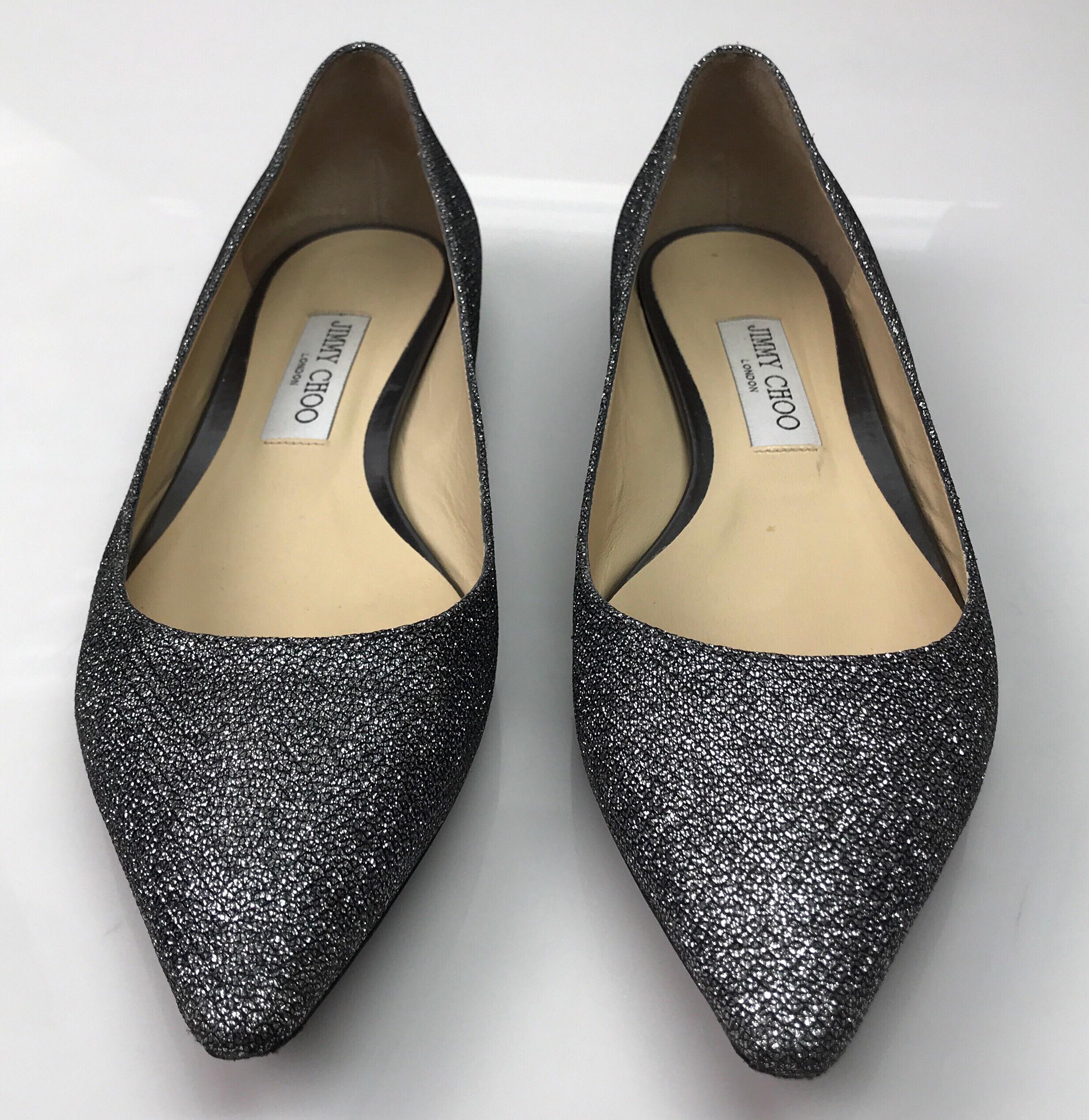 Jimmy Choo Gun metal Pointed Flats-39. These amazing Jimmy Choo pointed flats are in great condition. They show minor use on the bottom of the shoe. It has a sparkly gun metal color. The inside is a tan leather. These are the perfect evening shoe