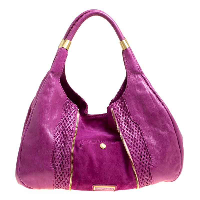 This Mandah hobo from Jimmy Choo proves that style can come in simple things too. Crafted from perforated leather, this lovely hot pink bag features a suede lined interior, two top handles, and a pocket at the rear. It is equipped with gold-tone