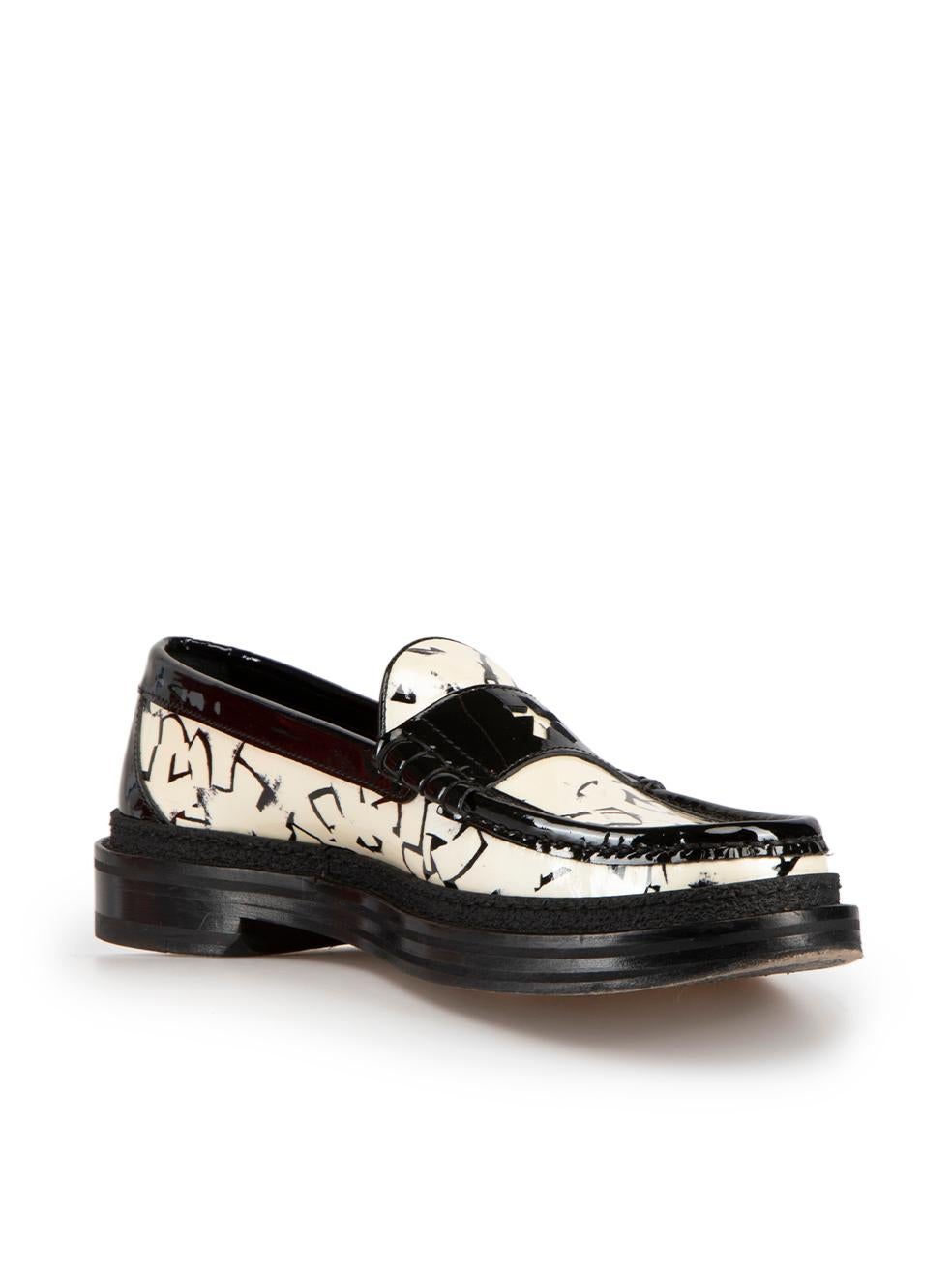 CONDITION is Very good. Hardly any visible wear to loafers is evident on this used Jimmy Choo x Eric Haze designer resale item.

Details
Jimmy Choo x Eric Haze
Black and white
Patent leather
Loafers
Round toe
Abstract pattern
Made in