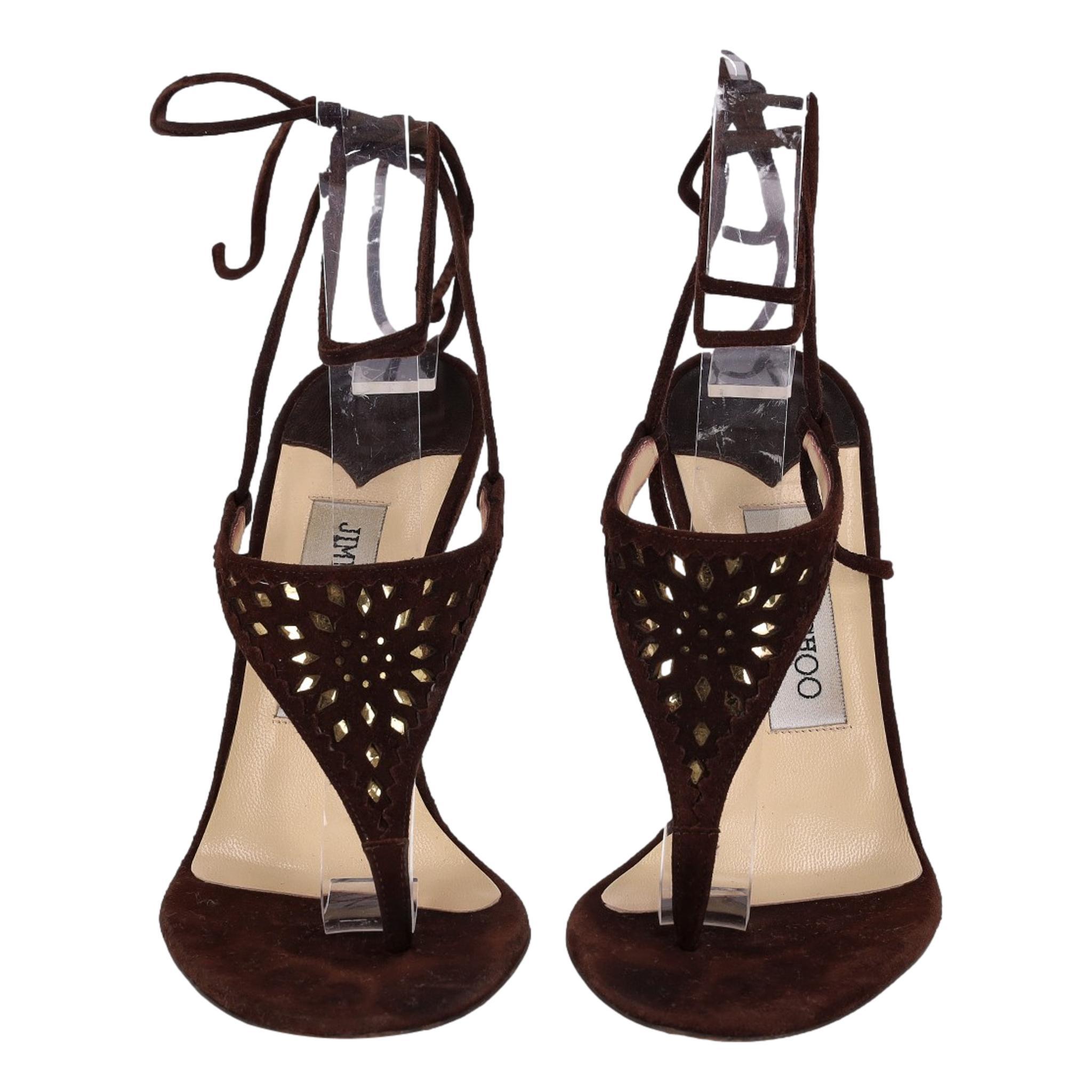 Jimmy Choo Laser-Cut T-Strap Suede Sandals

Brown heels designed with laser-cut decorative T-strap detail.

Featuring lace-up ankle fastening and stiletto heel.

Size – 36

Condition – Very Good (General signs of wear)

Composition – Suede

Comes