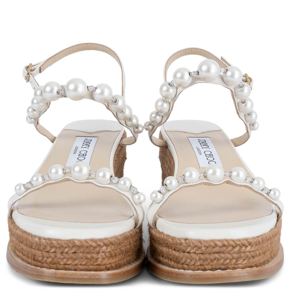 100% authentic Jimmy Choo Amatuus 60 pearl embellished wedge sandals in white Nappa leather and camel raffia sole. Brand new.

Measurements
Imprinted Size	37.5
Shoe Size	37.5
Inside Sole	24cm (9.4in)
Width	8cm (3.1in)
Heel	6cm (2.3in)
Platform:	3cm