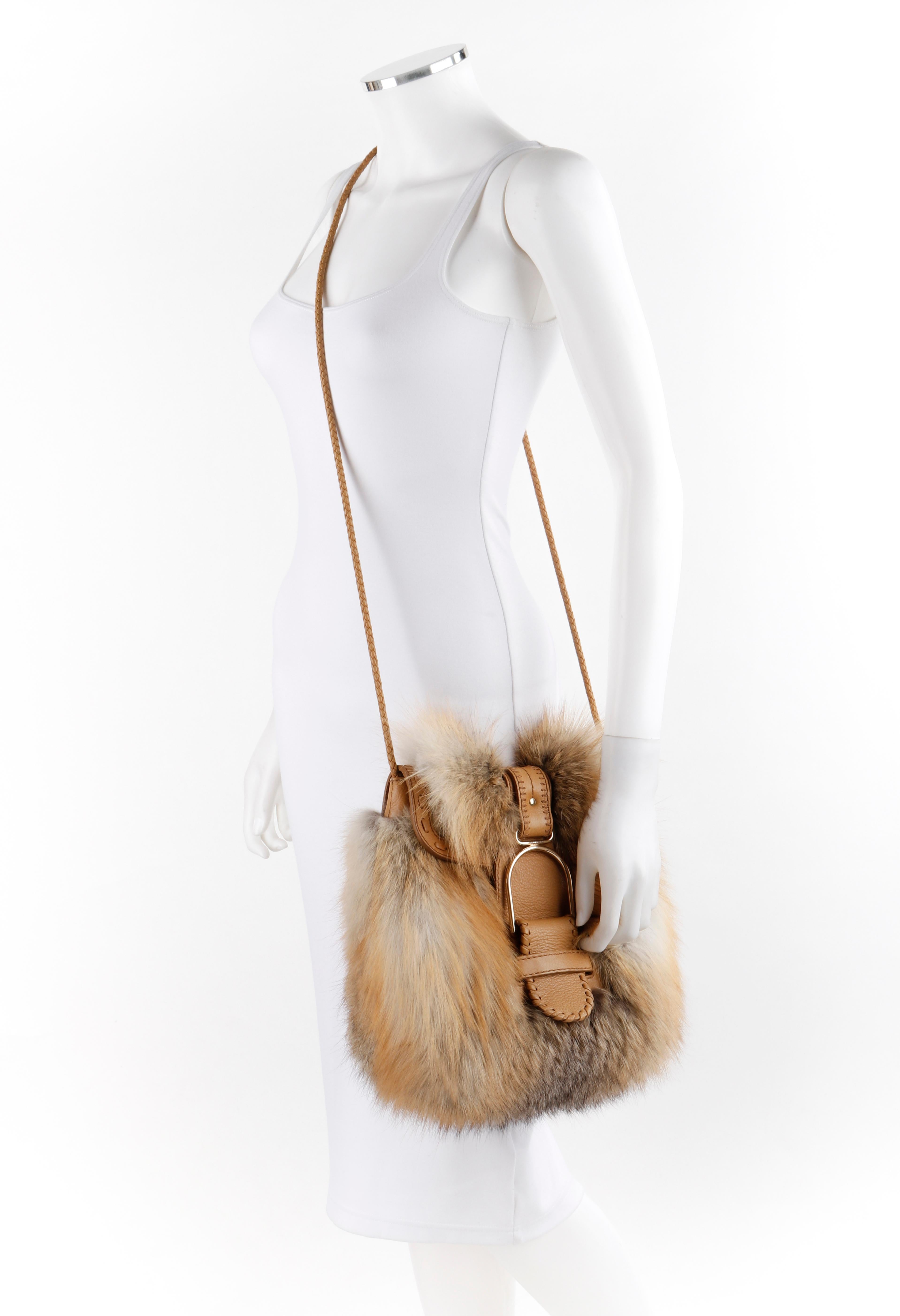 JIMMY CHOO Leah Red Fox Fur Leather Braided Cross-body Shoulder Bag
 
Estimated Retail: $3,650
 
Brand / Manufacturer: Jimmy Choo
Style: Cross-body / Shoulder Bag
Color(s): Natural red fox (various shading); Brown leather
Lined: Yes       
Unmarked