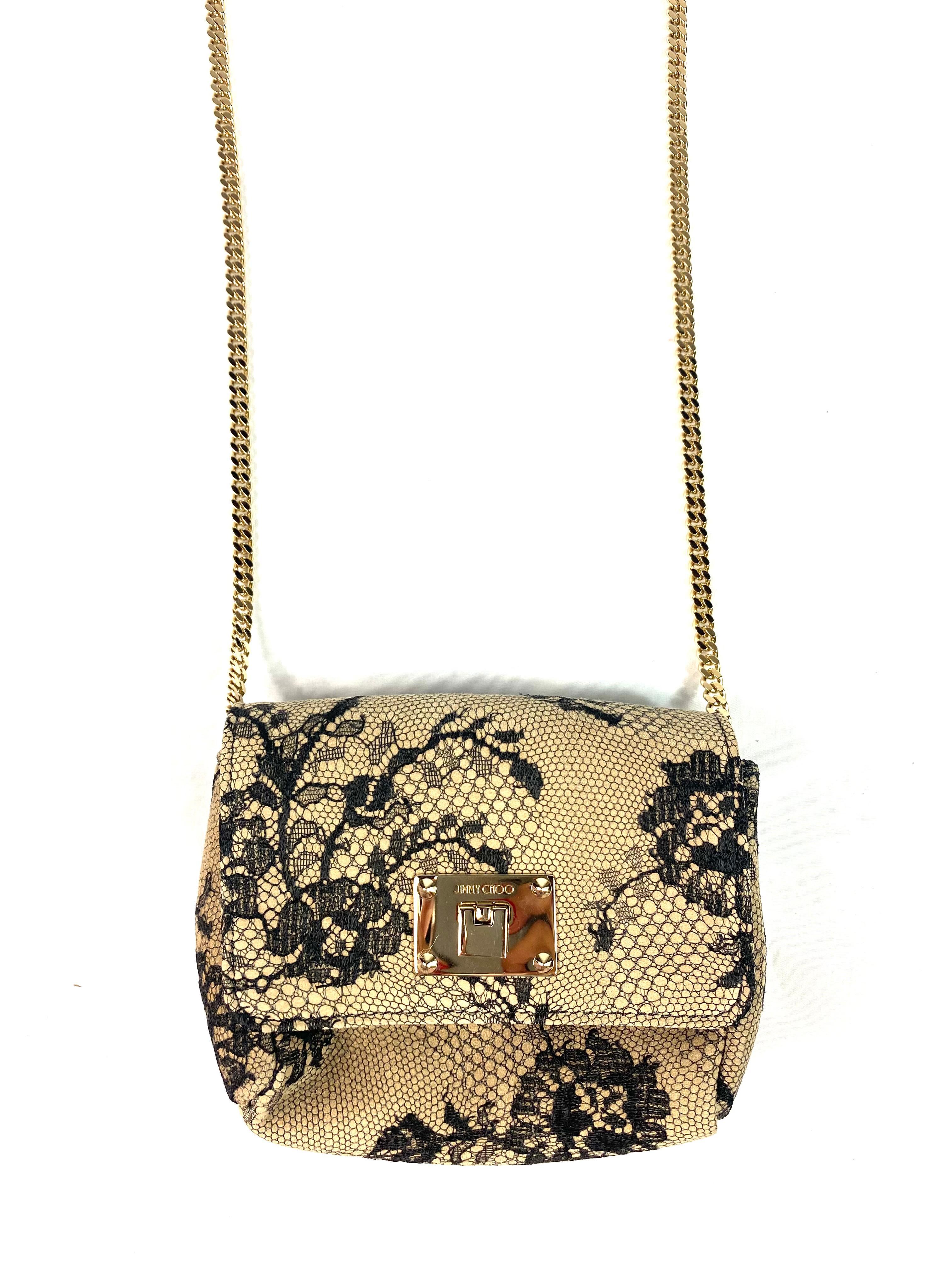 Product details:

The purse is made out leather covered with black floral lace, featuring gold tone hardware, chain shoulder strap (drops 24