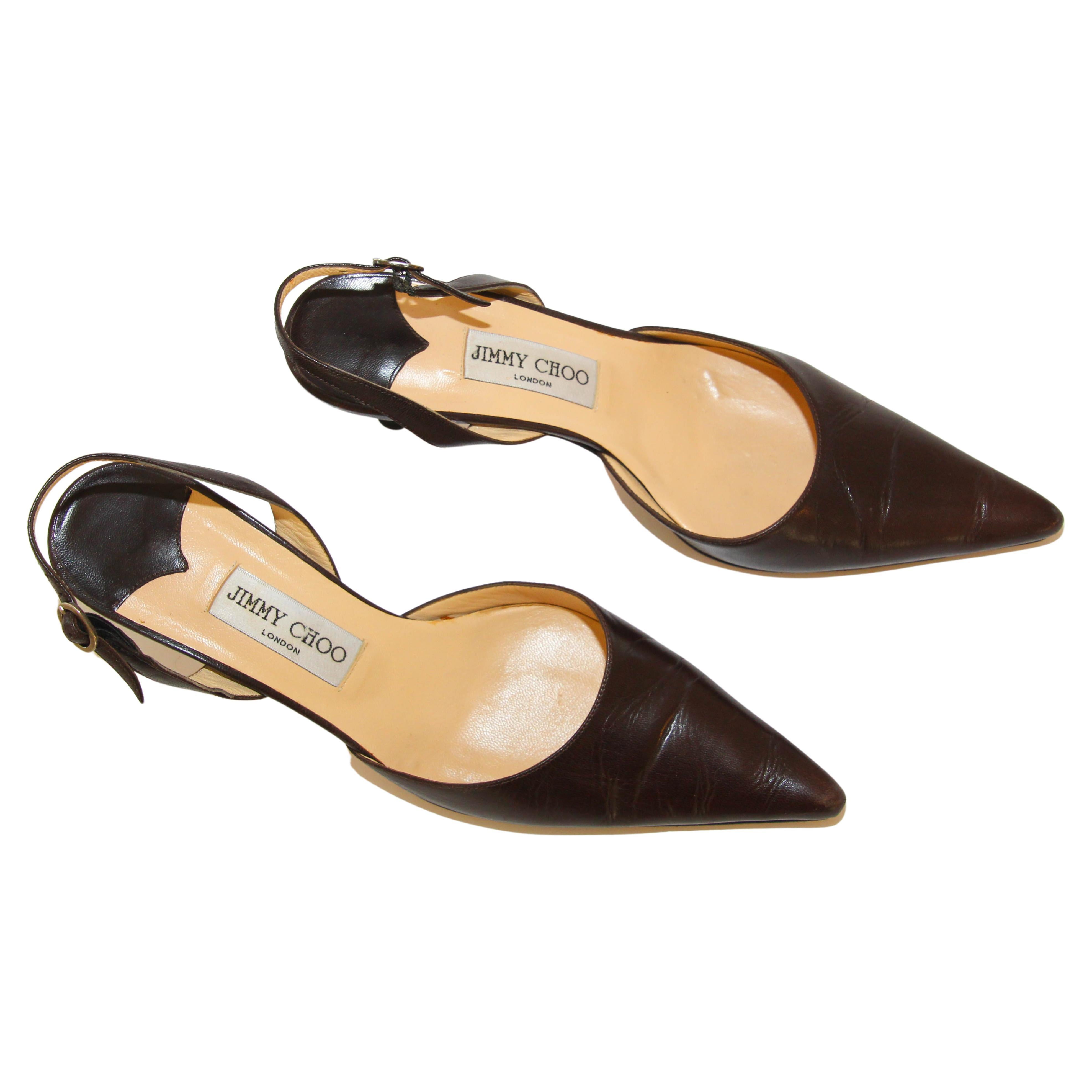 Jimmy Choo Dark Brown Leather Sling Backs Pointed Toe.
Brown Leather Slingback Pumps By Jimmy Choo London. 
Versatile Classic look that is timeless. 
Heel Height Is 2.75 Inches. 
Made In Italy. Size 39.5.
A classic shoe that can be dressed up or