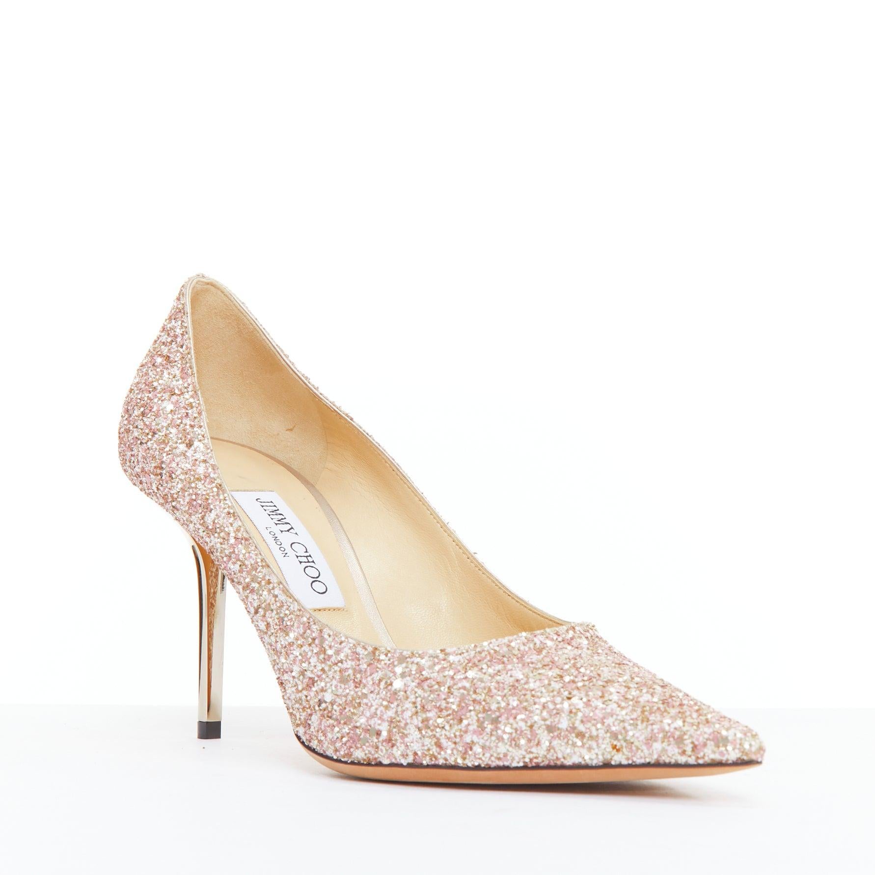 JIMMY CHOO Love 85 pink champagne glitter metal heel pumps EU39.5
Reference: JHDN/A00026
Brand: Jimmy Choo
Model: Love 85
Material: Fabric
Color: Pink, Gold
Pattern: Solid
Closure: Slip On
Lining: Nude Leather
Extra Details: Metallic mirrored