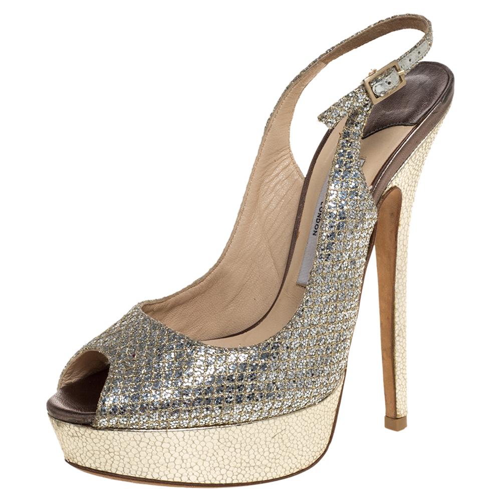 These gorgeous sandals from Jimmy Choo are waiting to be yours! The metallic gold sandals have been covered in glitter fabric & embossed leather and feature a peep-toe silhouette. They come equipped with leather-lined insoles, slingbacks, and 14.5