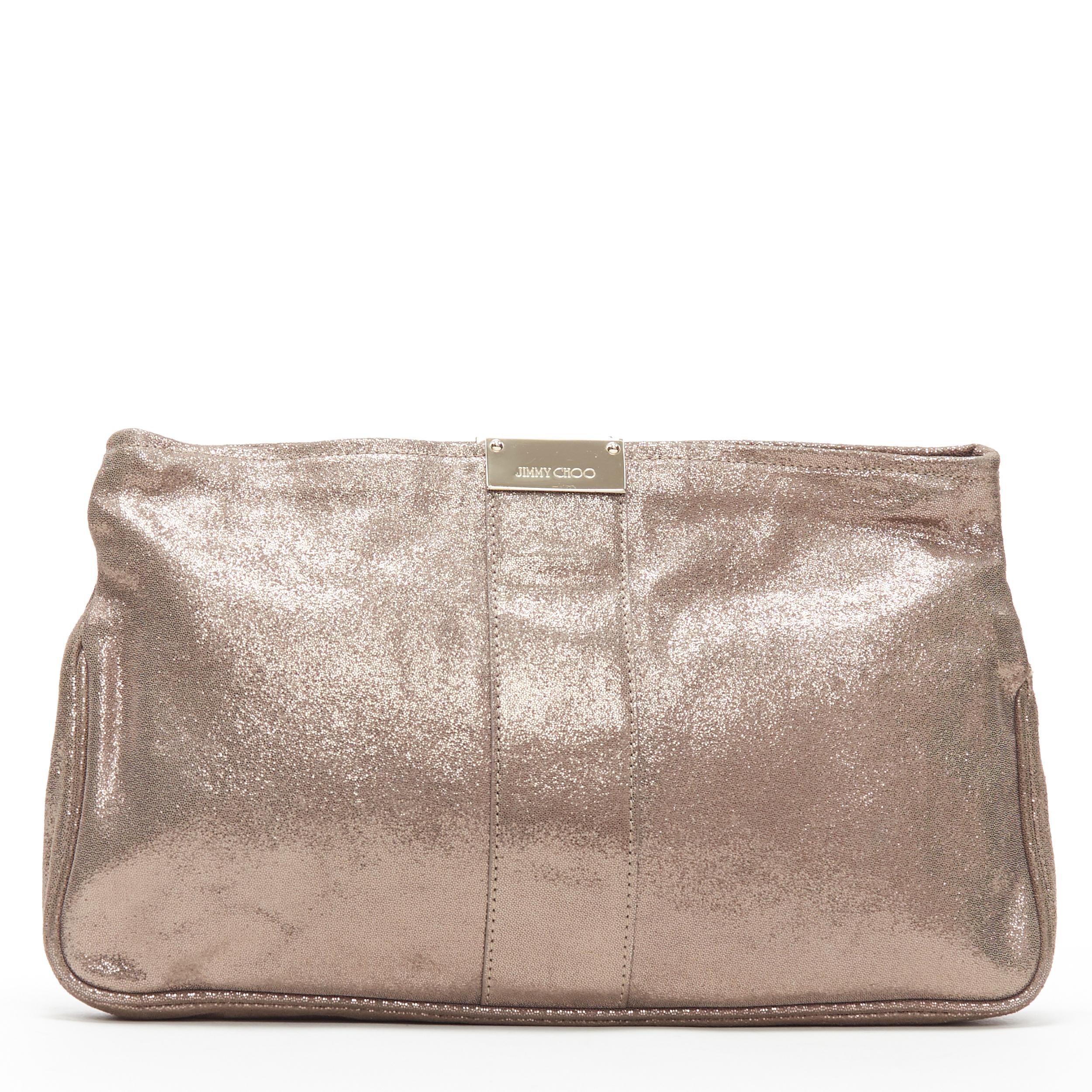JIMMY CHOO metallic gold leather logo buckle detail top zip pouch zip clutch bag
Brand: Jimmy Choo
Model Name / Style: Zip clutch
Material: Leather
Color: Gold
Pattern: Solid
Closure: Zip
Extra Detail:
Made in: Italy

CONDITION: 
Condition: