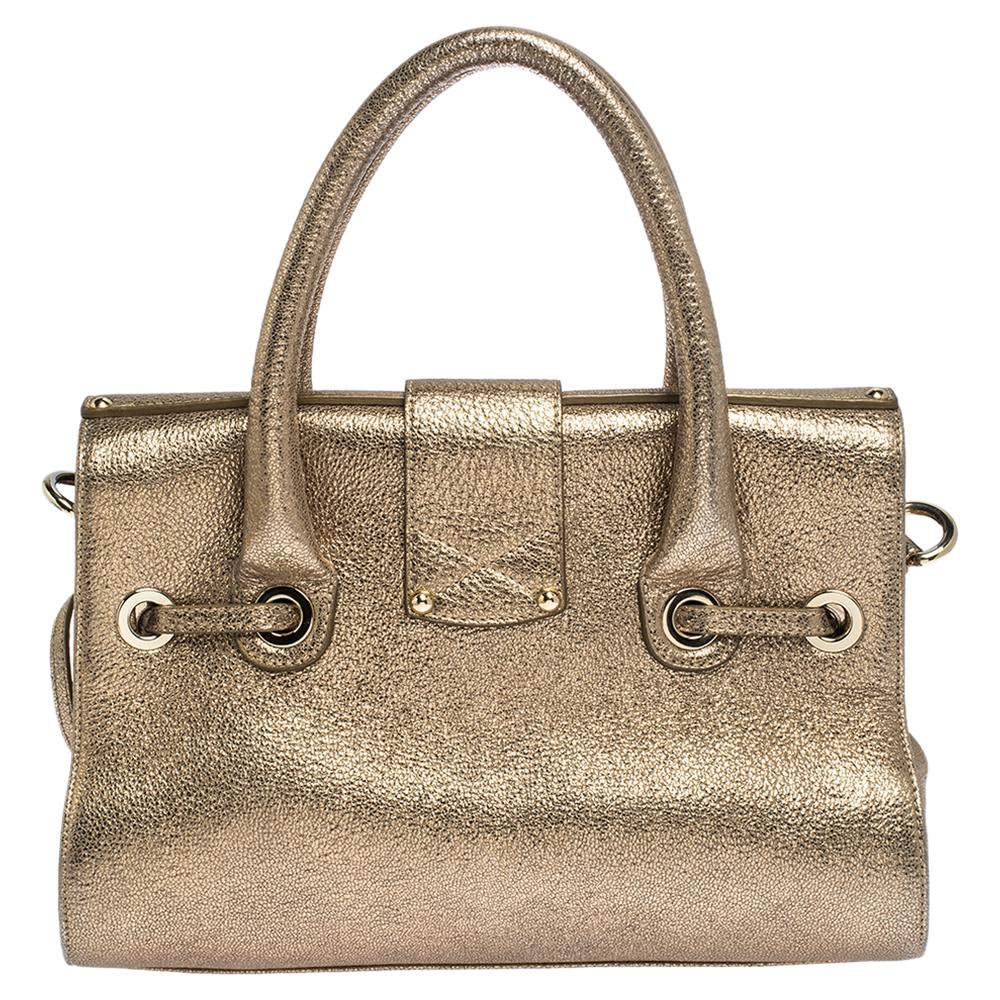 This Jimmy Choo Rosalie handle bag is a practical handbag with a wild touch. Crafted from leather, it is accented with a Jimmy Choo engraved flip-top closure in gold-tone hardware. It features a drawstring, top rolled double handles, removable and