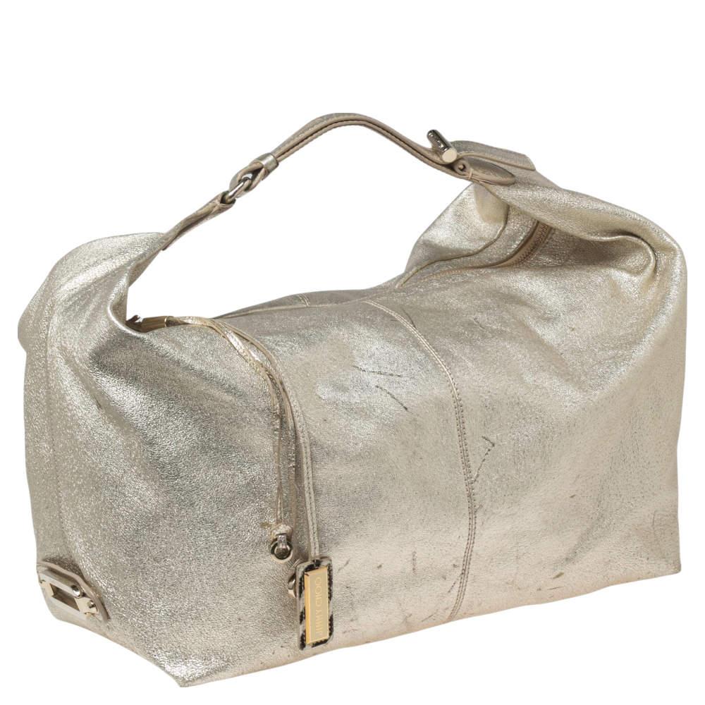 This beautifully stitched leather hobo is by Jimmy Choo. With a capacious fabric-lined interior, a comfortable handle, and a fine finish, this hobo is bound to offer style and practical ease.

