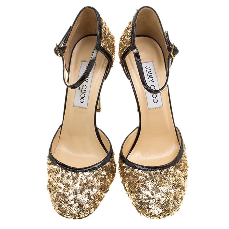 Be ready to see people drooling whenever you step out in this pair of sandals by Jimmy Choo. They are covered in sequins and styled with ankle straps and 9.5 cm heels. You can glitter away at evening parties with this stunning pair.

