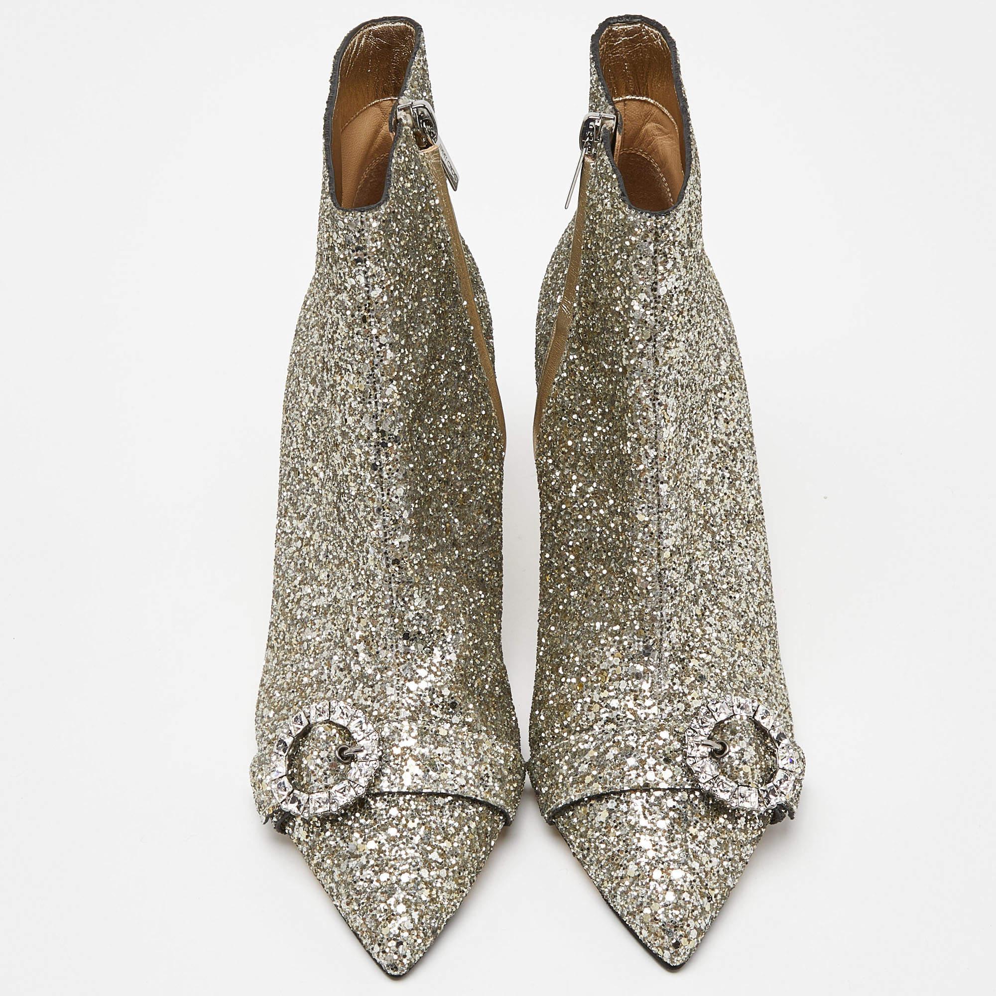 A pair of silver glitter booties to add that extra tinge of luxury to any outfit! The design is by Jimmy Choo, and it has a pointed-toe silhouette set on low heels.

