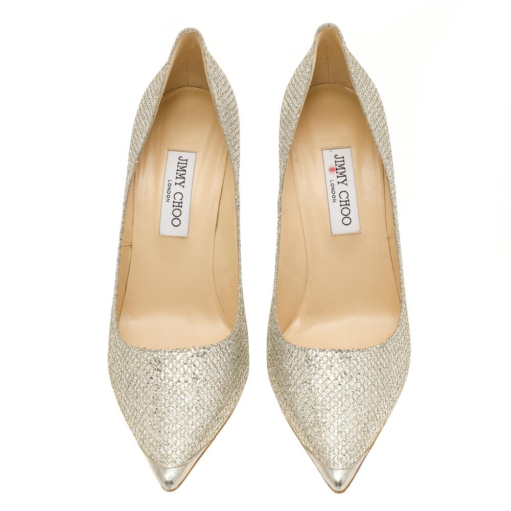 Gloss up your look in these Abel pumps from Jimmy Choo. Crafted from lurex fabric, they feature pointed toes, stiletto heels and Leather lined insoles carrying the brand's label. Feminine and chic, these pumps will make you shine.

Includes: