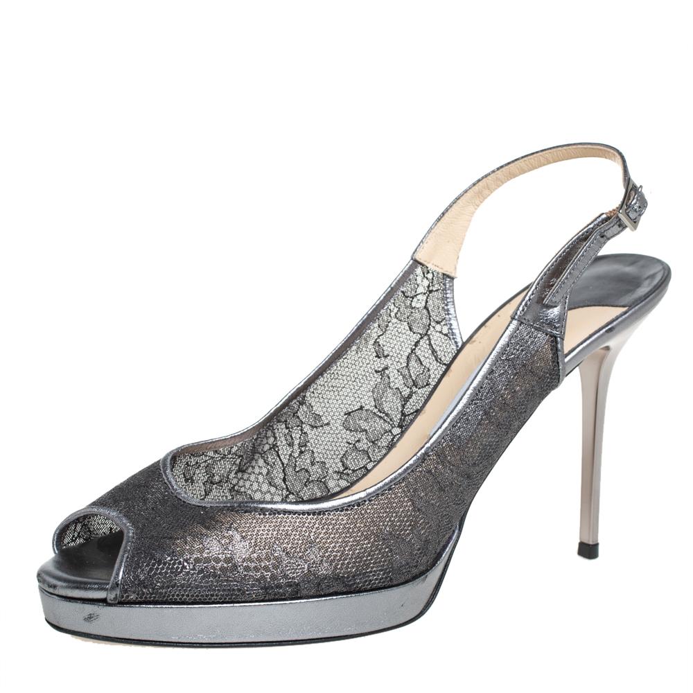 These gorgeous sandals from Jimmy Choo can't wait for you to make them yours! The metallic silver sandals have been crafted from an artistic combination of lace and leather trims and feature a peep-toe silhouette. They flaunt buckled slingbacks and