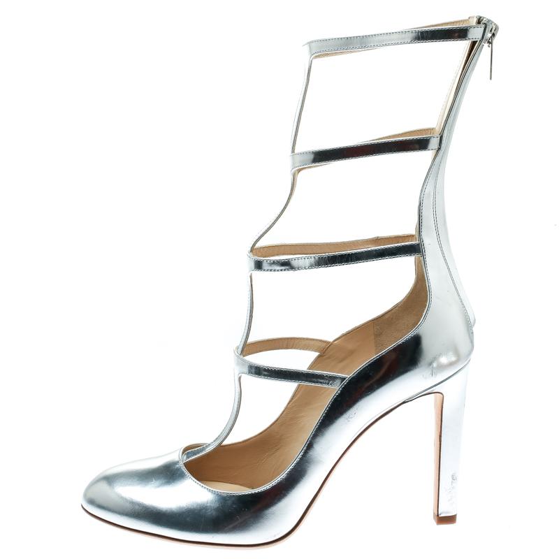 Crafted from metallic silver leather in a caged design of straps that rise close to the calves, these Jimmy Choo pumps are stunning. Round toes, back zippers and 11 cm heels ready the pair to be worn on glitzy nights.