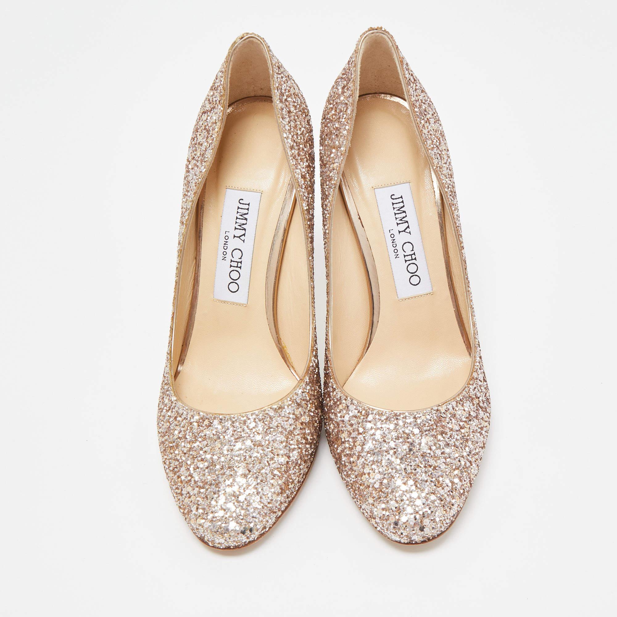 Jimmy Choo never fails to impress with its elegant designs, and this pair of Romy pumps is a fine example. Made from glitter, it will lend you a stellar style statement, and its 10cm heels will add grace to your every step.

Includes: Original Box

