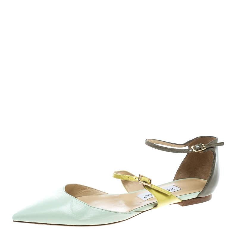 Gorgeous is the word for these D'orsay flats from Jimmy Choo. The multicolor flats are crafted from leather and feature pointed toes. They flaunt a buckled strap across the vamps and come equipped with ankle straps and comfortable insoles. Grab them