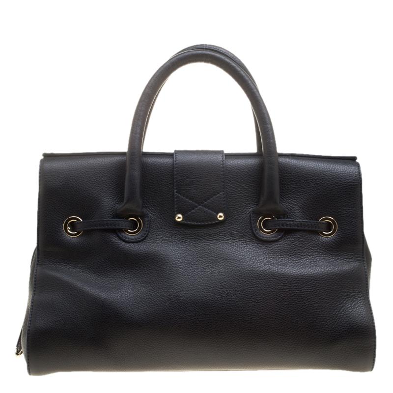 This versatile bag can be used to complement for both your day or evening looks. Made in leather, it is high on style and comes with a suede-lined interior. This one in navy blue from the house of Jimmy Choo is ideal to lighten up your