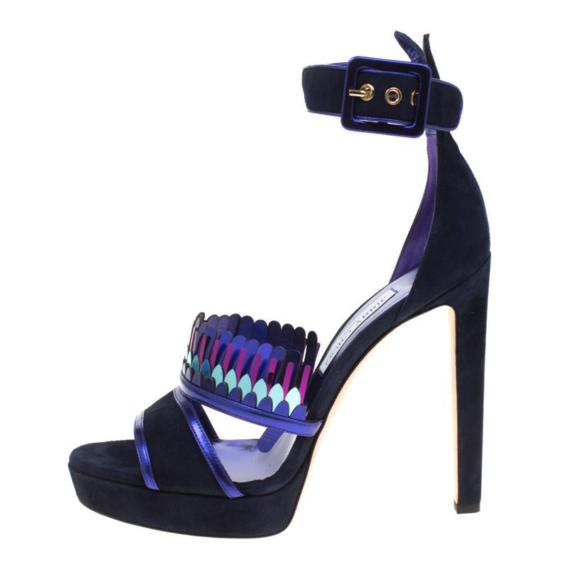 These Kathleen sandals from Jimmy Choo are one of a kind and breathtakingly beautiful! The navy blue sandals have been crafted from suede and feature a peep-toe silhouette. They flaunt cutout detailed artistic vamp straps and come equipped with