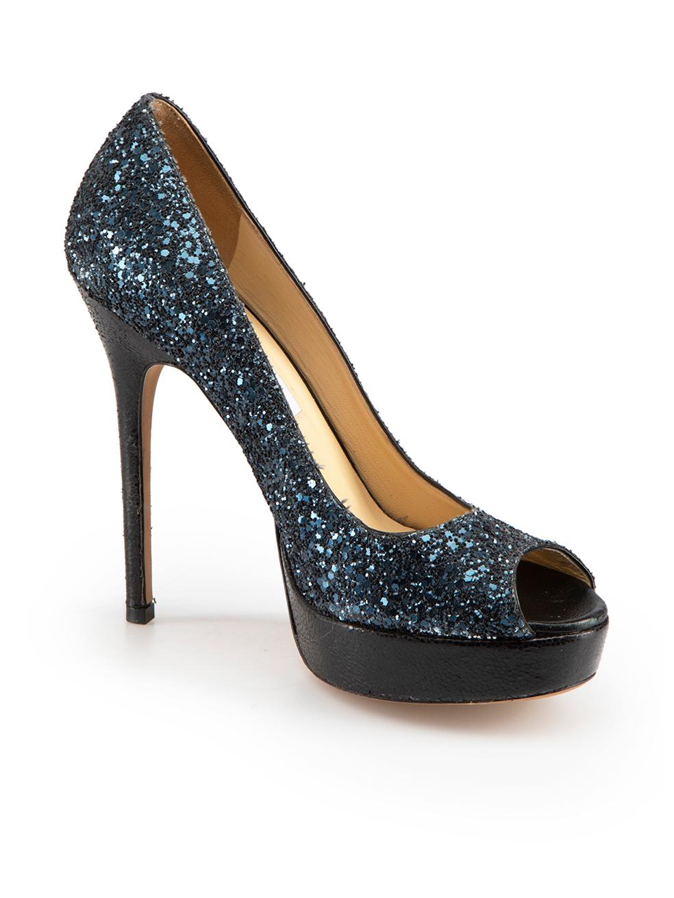 CONDITION is Very good. Minimal wear to heels is evident. Minimal creasing to inner leather and minor scuffing to left toe cap on this used Jimmy Choo designer resale item.
  
Details
Navy
Glitter
Heels
Peep toe
Slip on
High heeled
Platform
Black