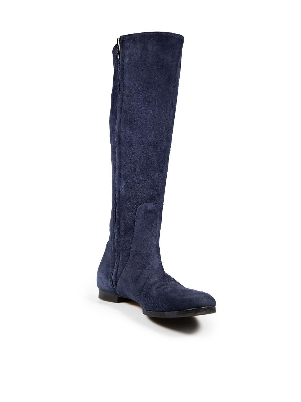 CONDITION is Very good. Minimal wear to the boots is evident. Scratching to both zipper pulls. Minimal wear to the front and counter of both shoes. Discolouration on the zipper protector on the left shoe on this used Jimmy Choo designer resale item.