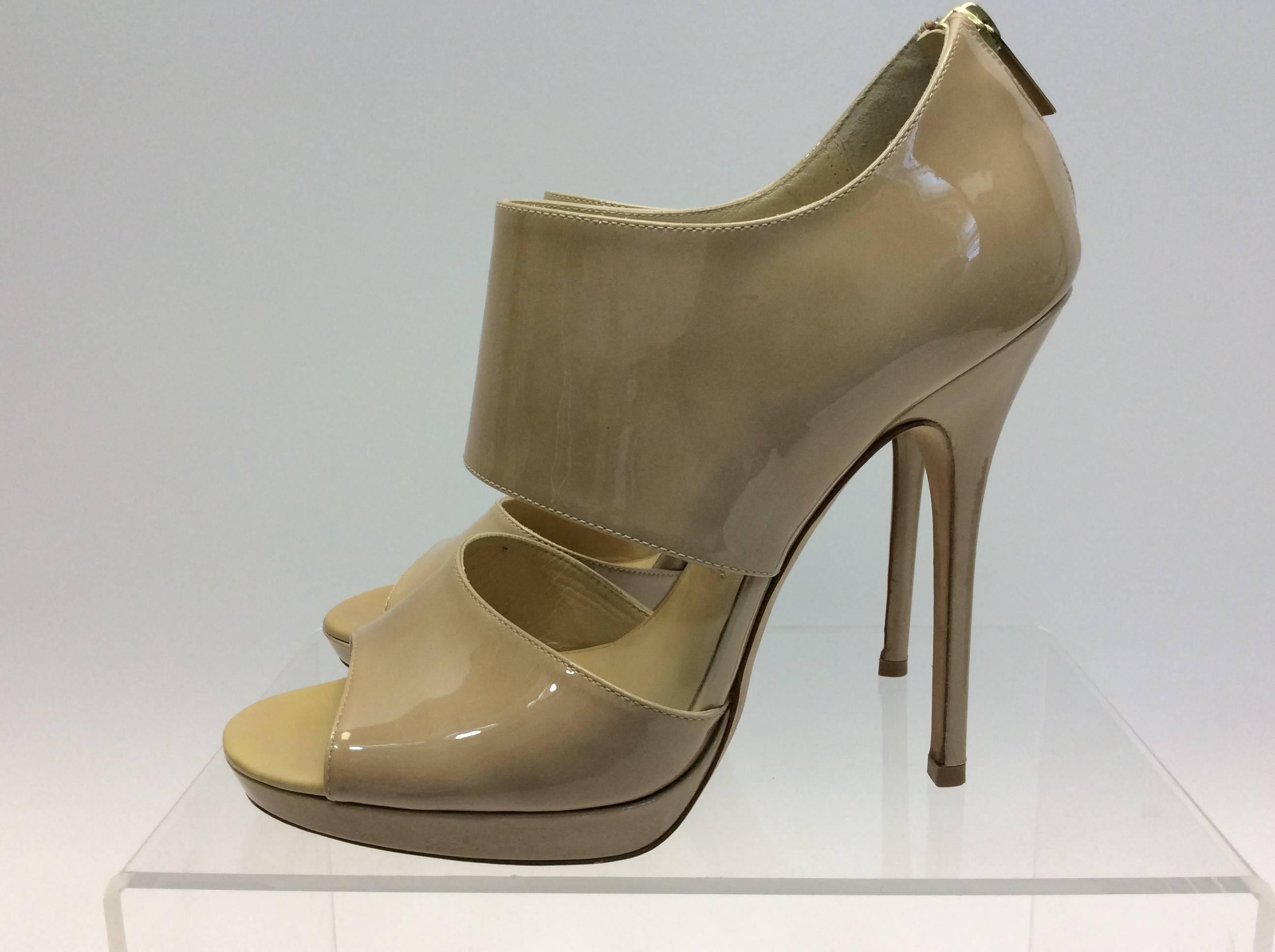 Jimmy Choo  Nude Patent Leather Heels
Leather
$350
5