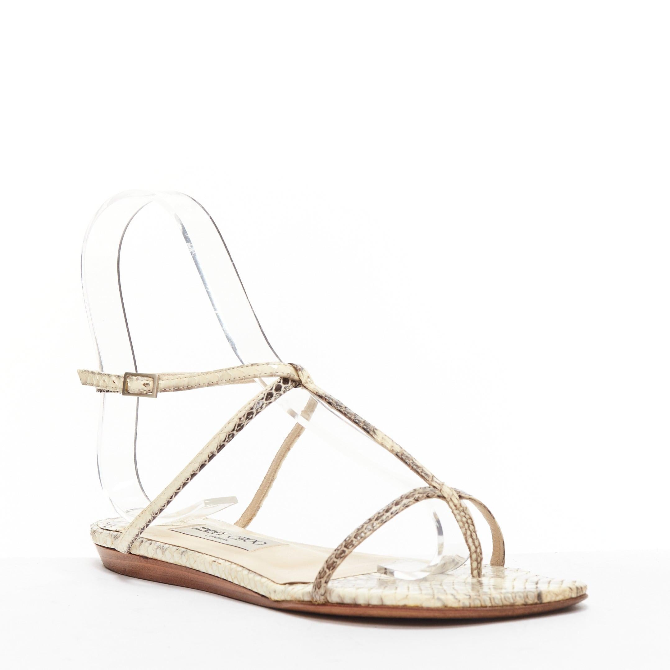 JIMMY CHOO nude scaled leather strappy thong flat sandals EU37
Reference: SNKO/A00368
Brand: Jimmy Choo
Material: Leather
Color: Nude
Pattern: Animal Print
Closure: Ankle Strap
Lining: Nude Leather
Made in: Italy

CONDITION:
Condition: Very good,
