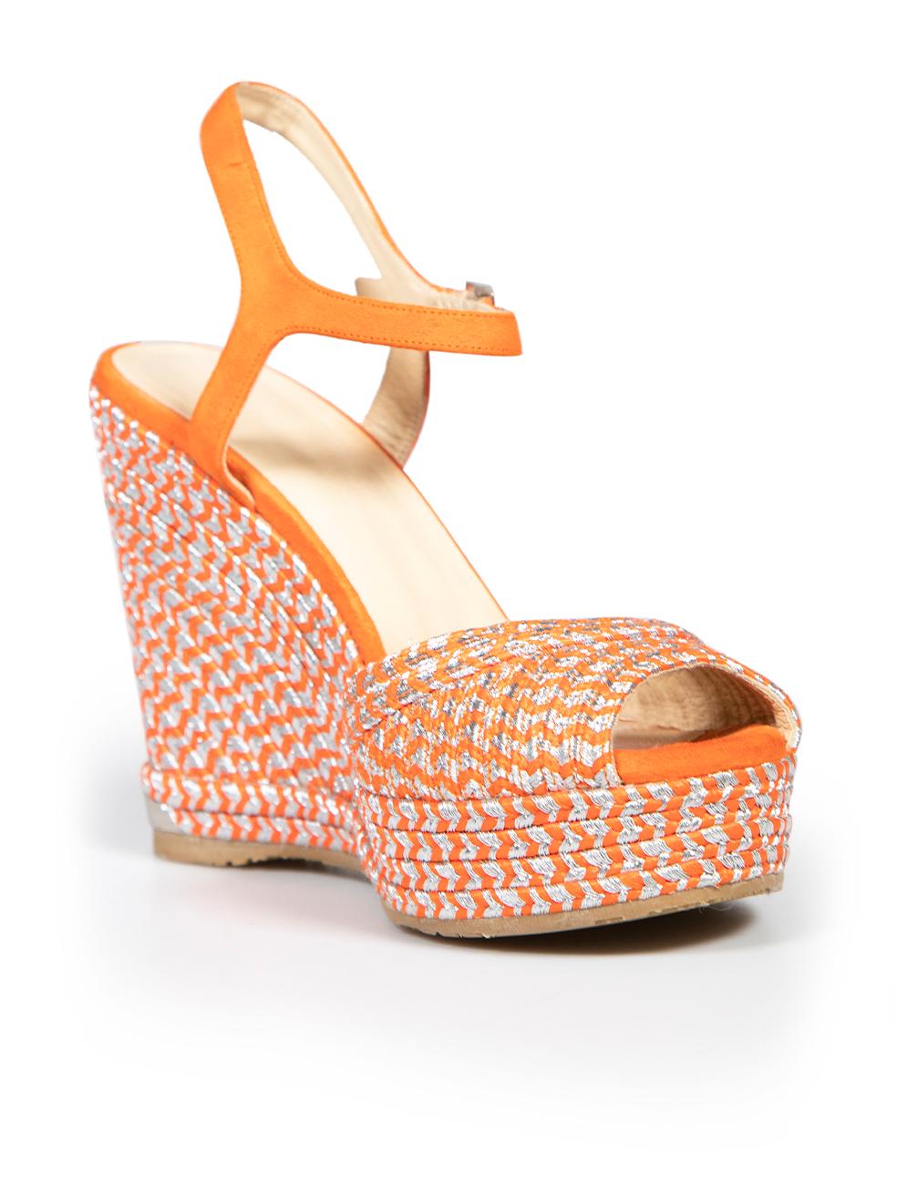 CONDITION is Very good. Minimal wear to wedges is evident. Minimal wear to suede insoles and suede straps on this used Jimmy Choo designer resale item.
 
 
 
 Details
 
 
 Mode: Perla 120
 
 Orange
 
 Cloth
 
 Wedges
 
 Silver metallic woven