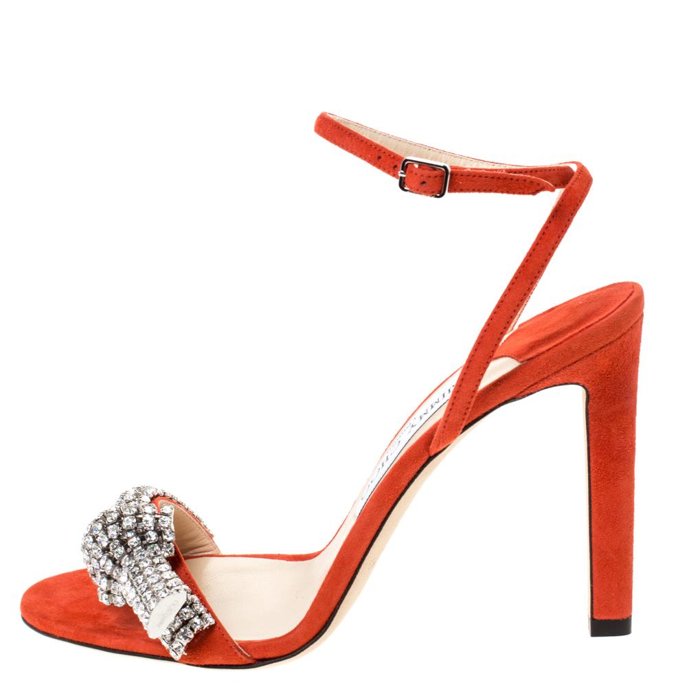 These sandals crafted from suede are they epitomise style and bling. Flaunt your stylish best side with these orange sandals that feature crystal-embellished frontal straps, buckle ankle straps and 11 cm heels. Jimmy Choo brings you all the latest