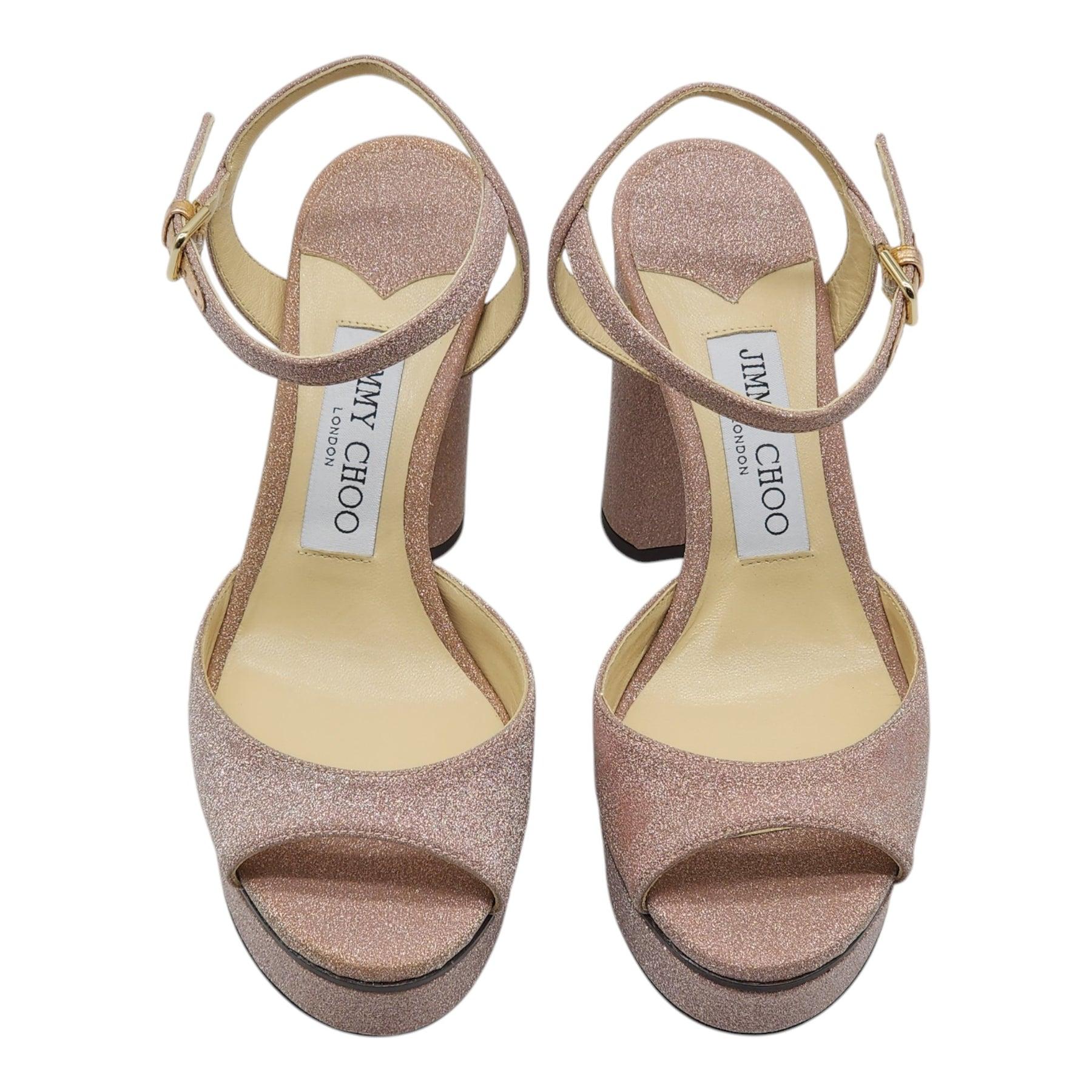 Vintage-inspired leather platform sandals by Jimmy Choo. Glitter Fabric. 

Additional information:
Material: Fabric
Peep toe
Adjustable ankle strap
Leather lining
Leather platform sole
Color: Pink
Size: 35 EU (4.5 - 5 US)
Country: Italy
Dimension: