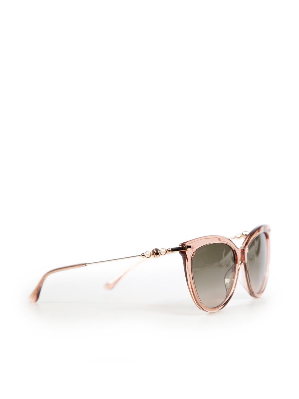 CONDITION is Very good. Hardly any visible wear to sunglasses is evident on this used Jimmy Choo designer resale item. The item comes with its original case.
 
 Details
 
 
 Pink 
 
 Acetate
 
 Sunglasses
 
 Cat eye
 
 Logo detail
 
 Pearl detail
 
