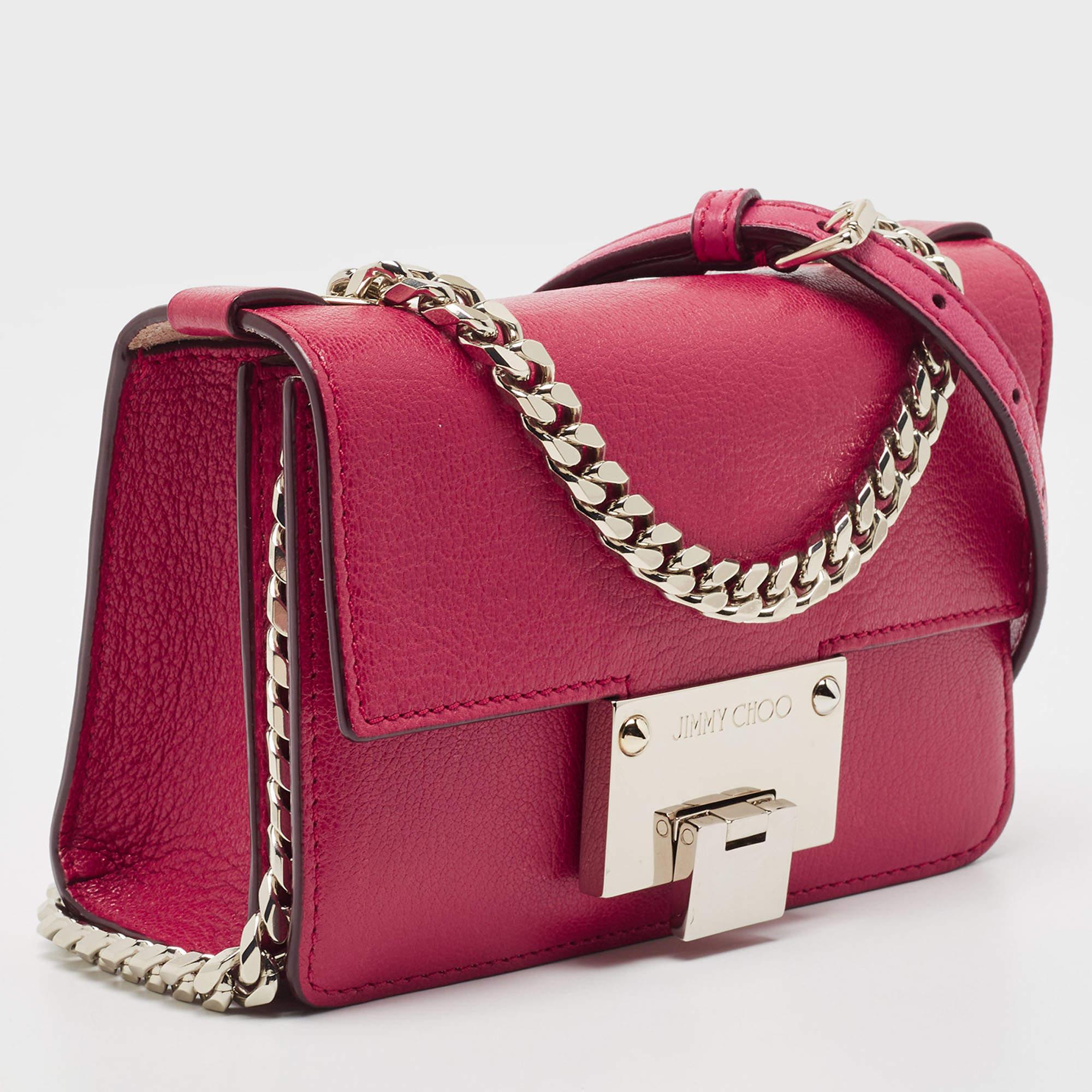 This stunning Rebel crossbody bag from Jimmy Choo is high on appeal and style. The bag is crafted from leather and designed with a flap that has a flip lock and leads way to a suede-lined interior. The bag is held by a top handle and an adjustable